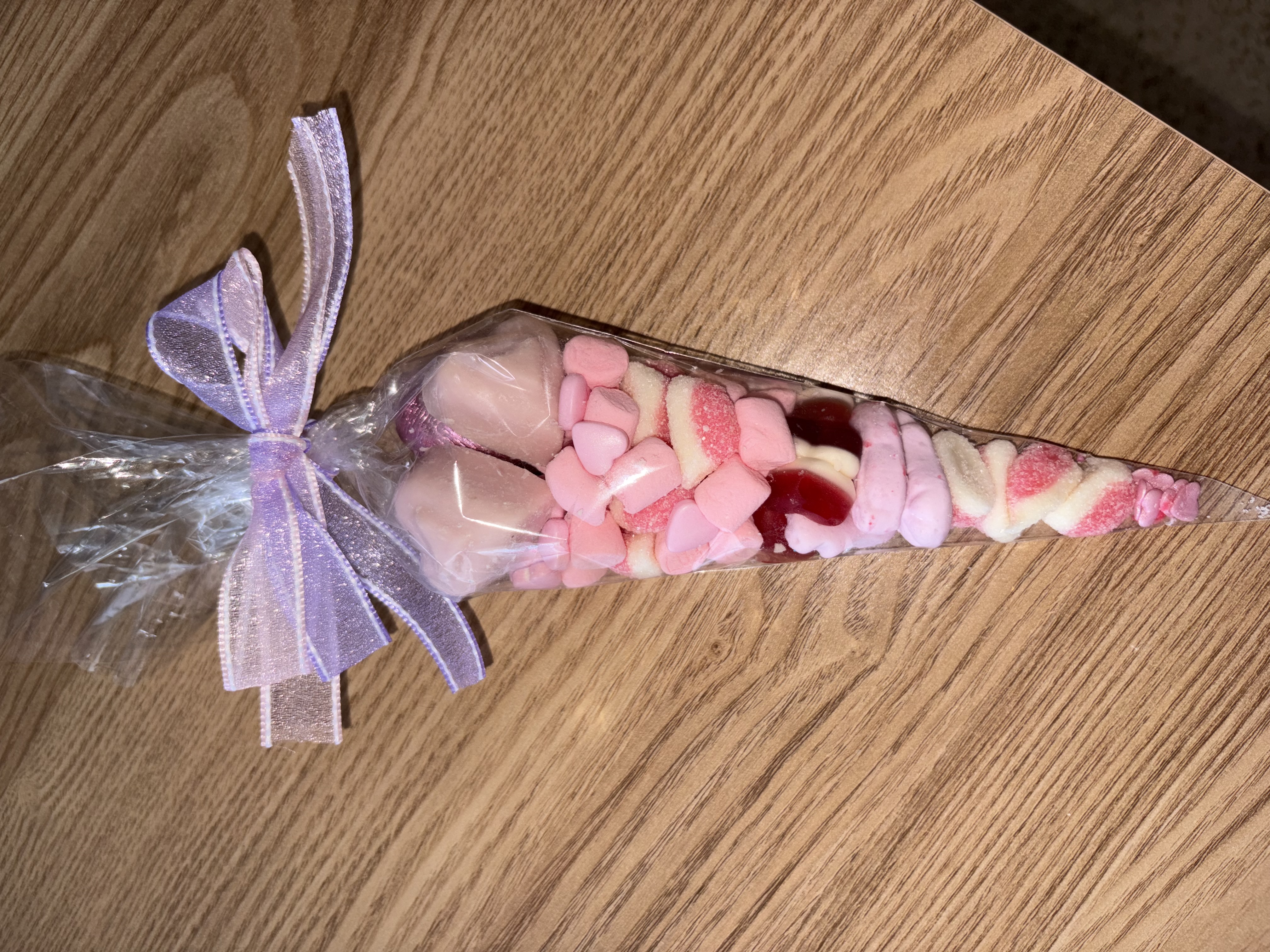 Beautiful pink sweetcone with two tone organzq ribbon to the top 
