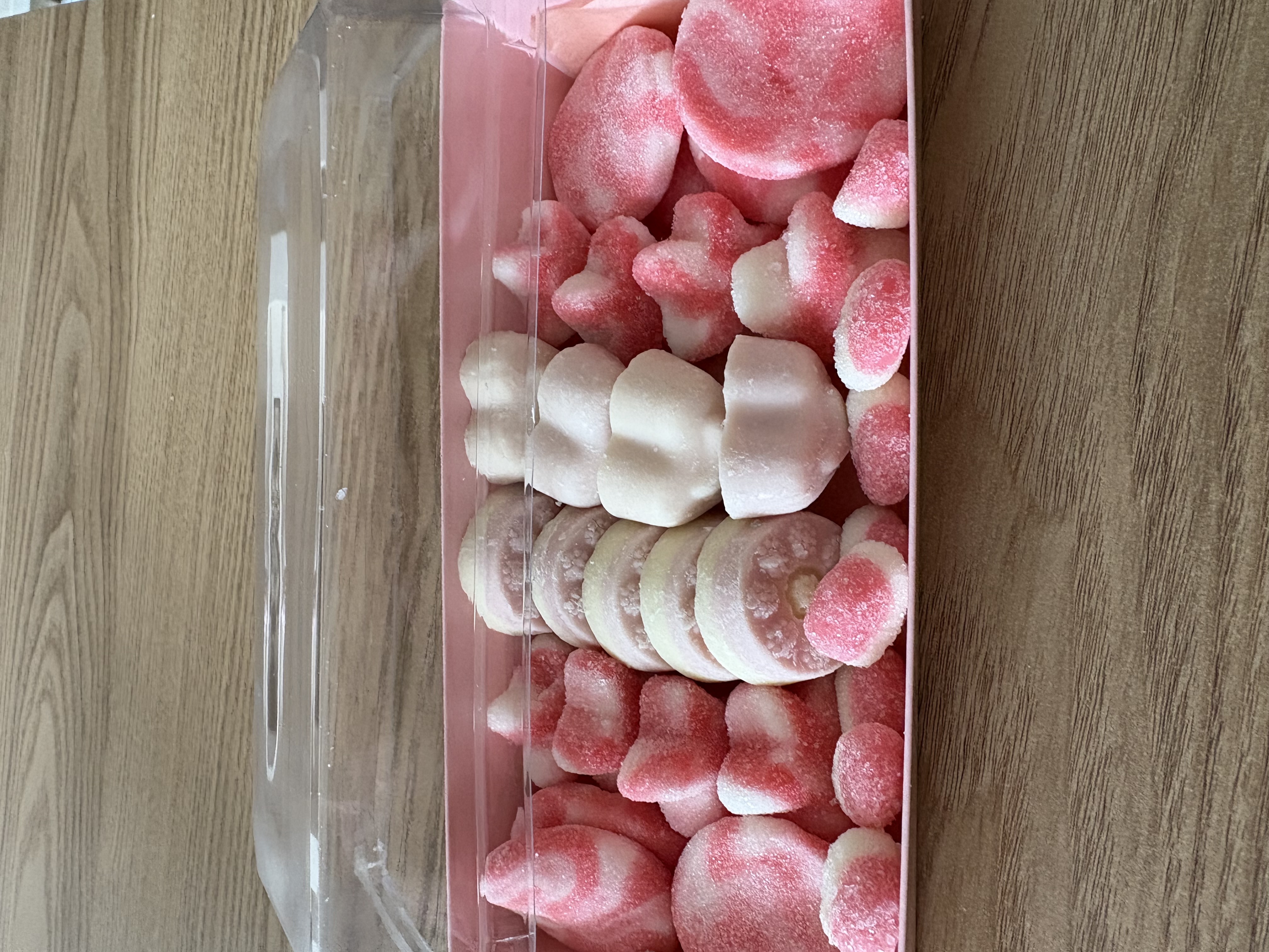 Pink rectangular sweet tray complete with sweets