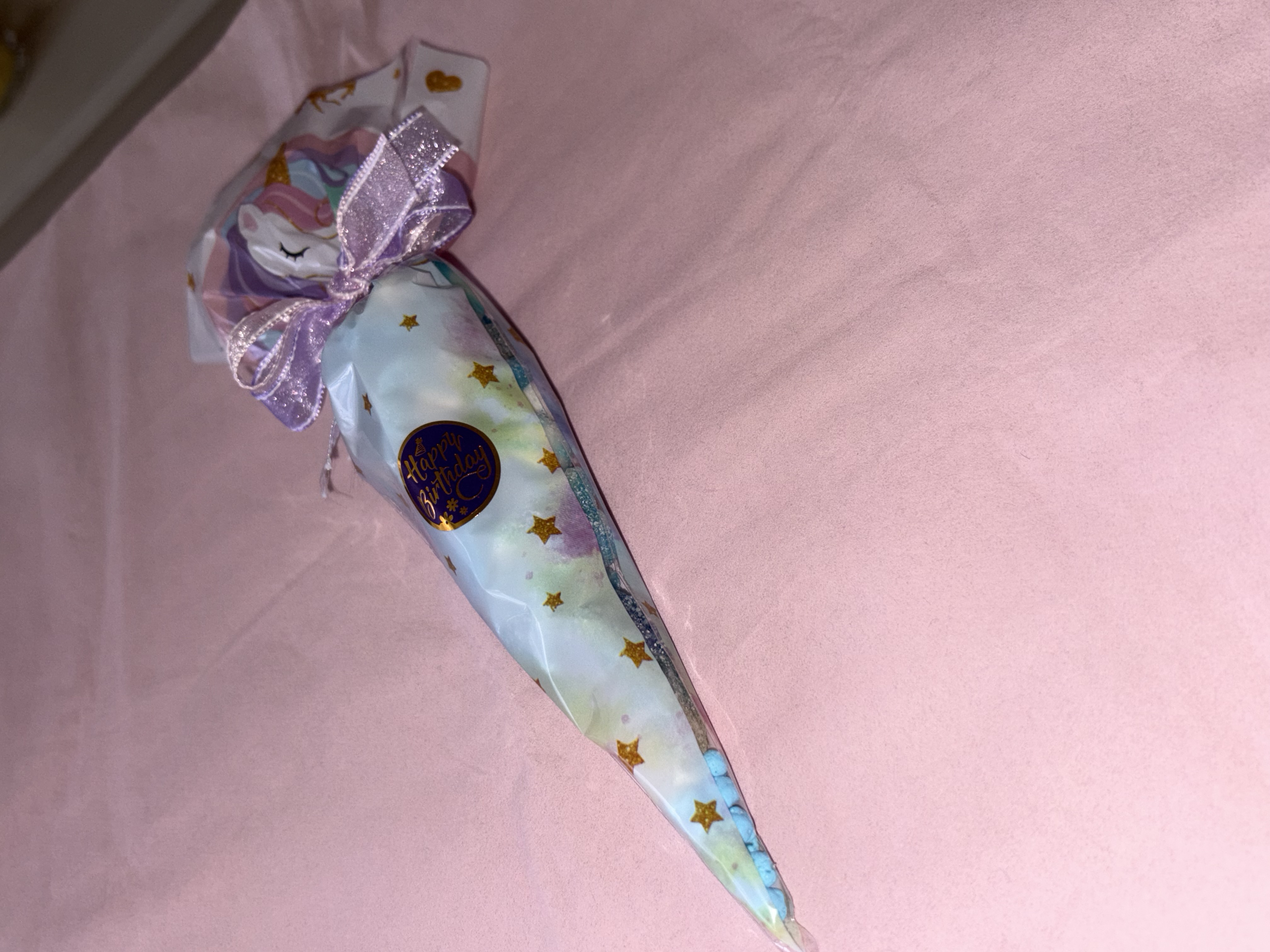 Unicorn Candy Cone complete with a variety of sweets and finished with a beautiful two tone organza ribbon