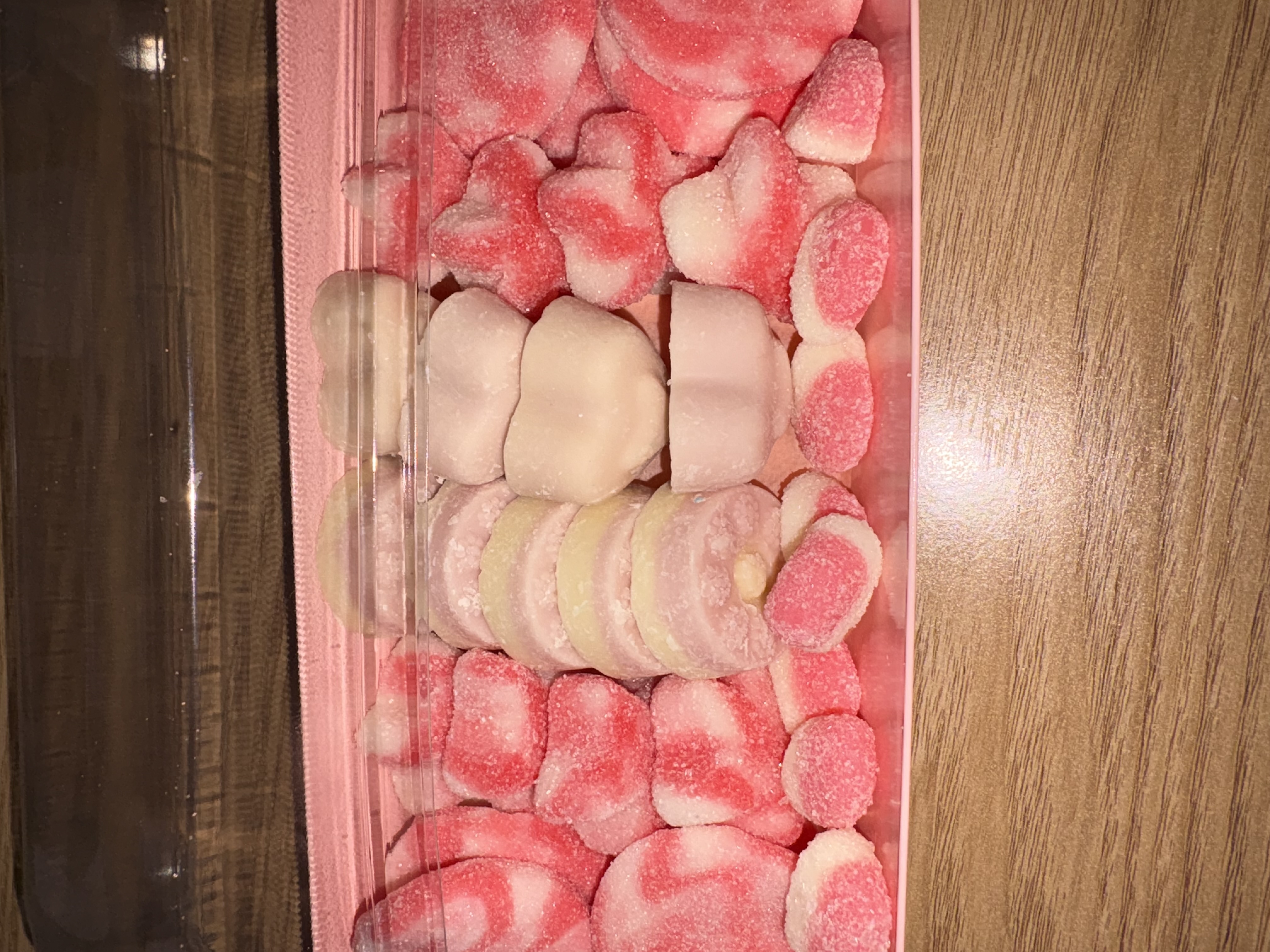 Pink rectangular sweet tray complete with sweets