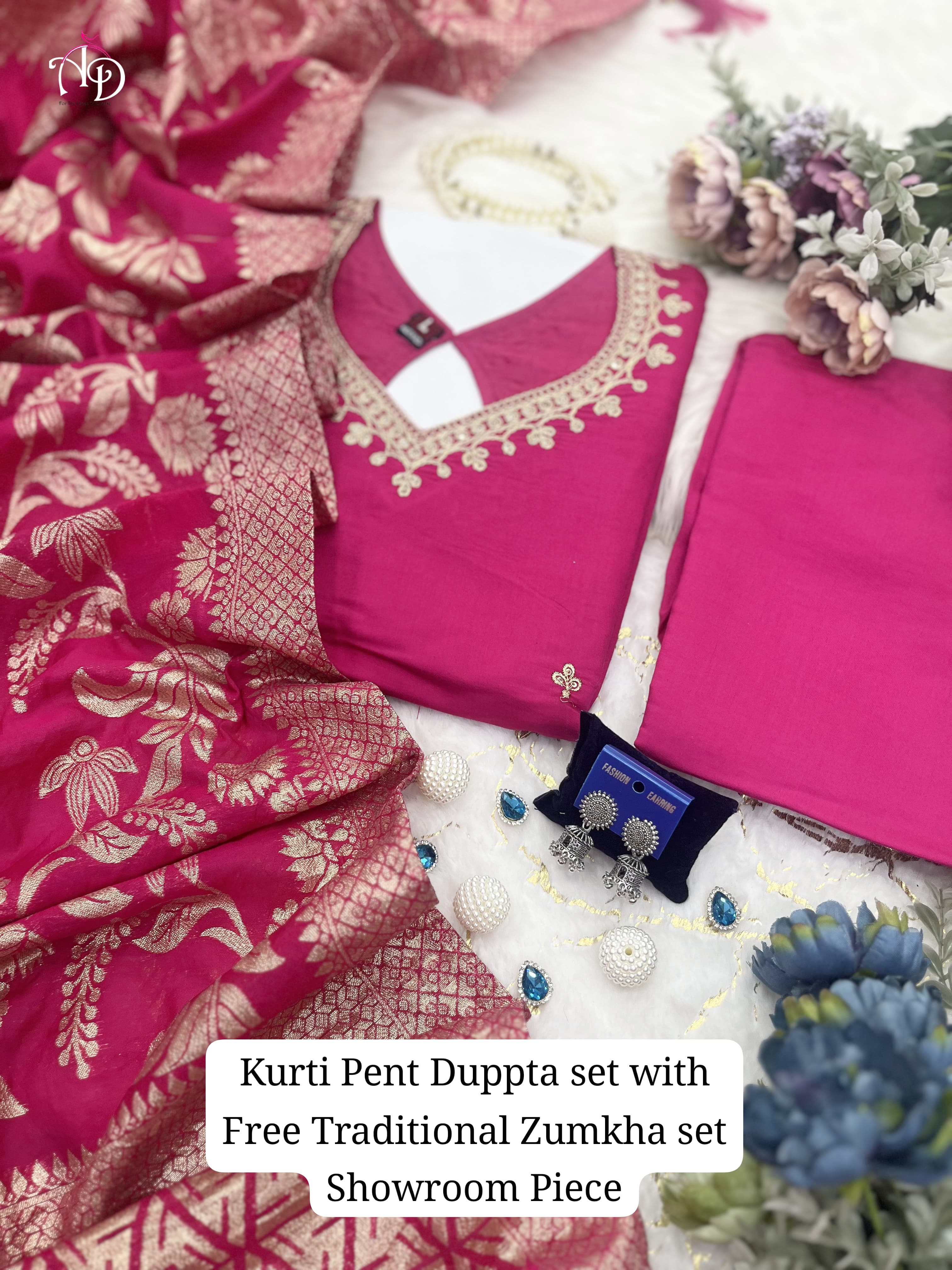 Suit Set which is beautifully decorated with intricate hand embroidery,