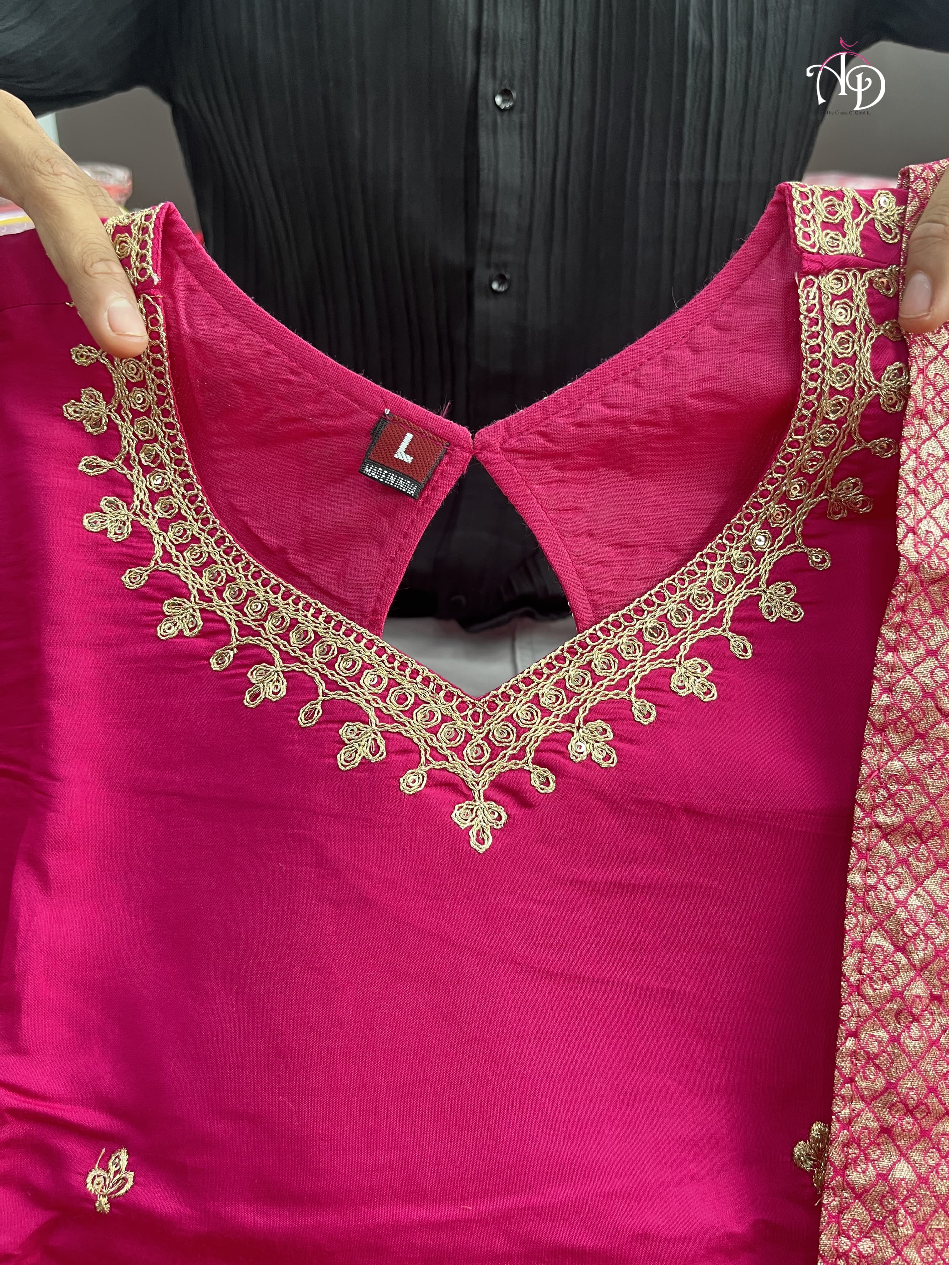 Suit Set which is beautifully decorated with intricate hand embroidery,