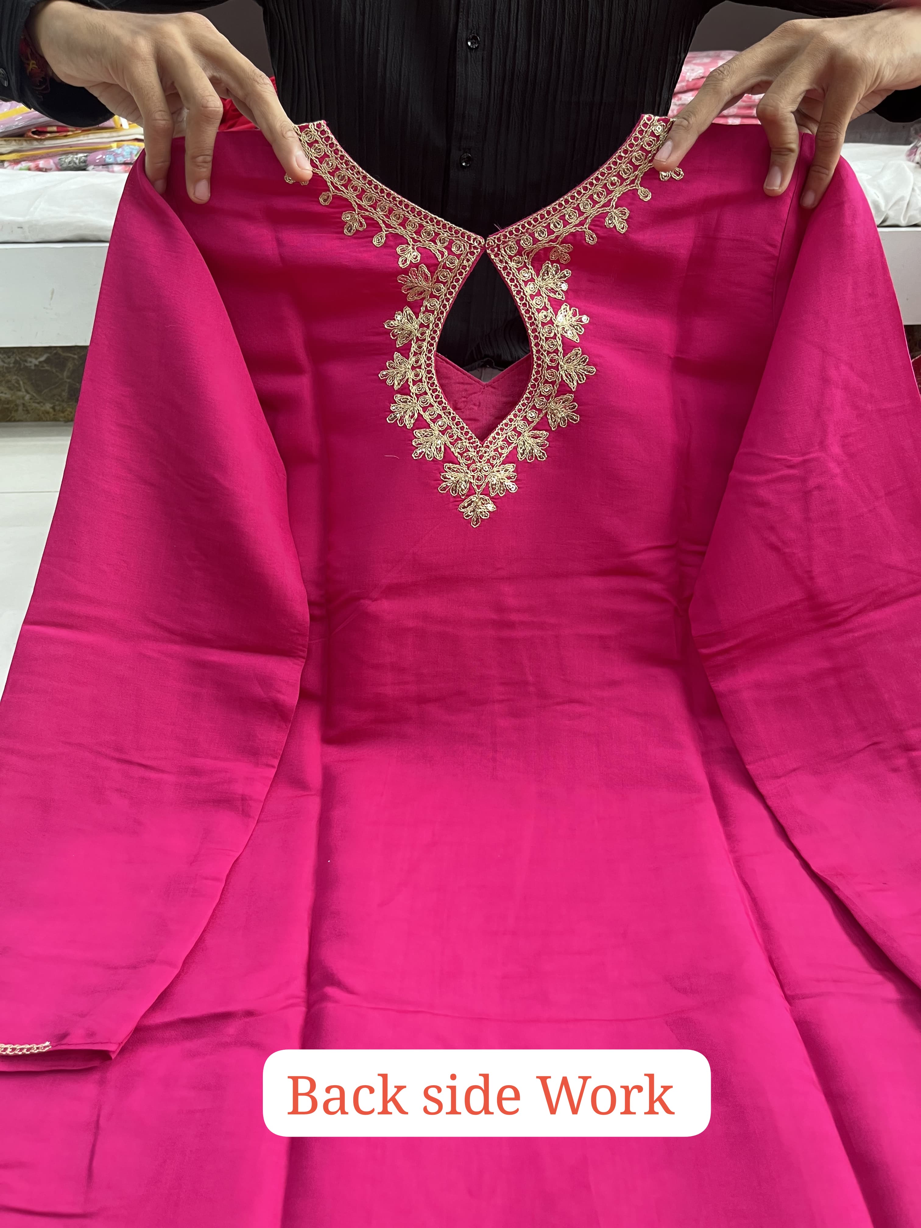 Suit Set which is beautifully decorated with intricate hand embroidery,