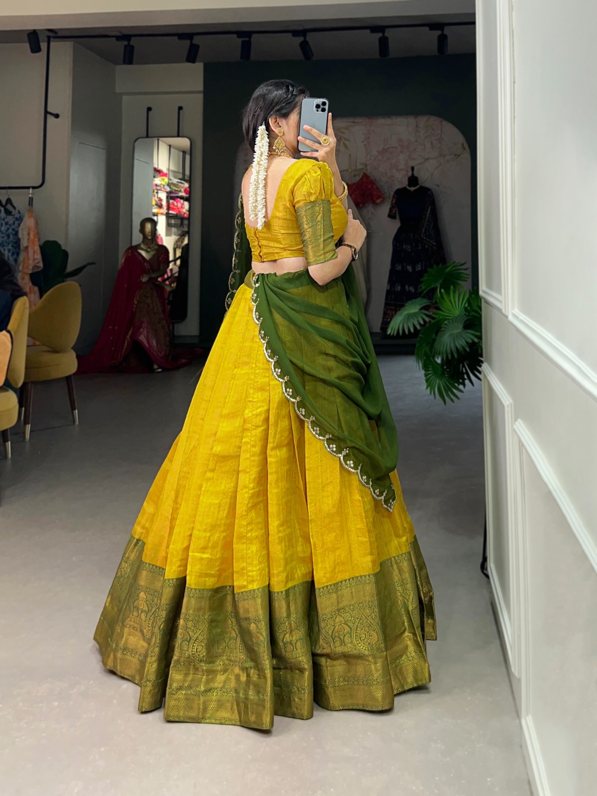 Experience the luxury of Kanjivaram silk in this regal lehenga choli ensemble, completed with a flowing embroidery dupatta.