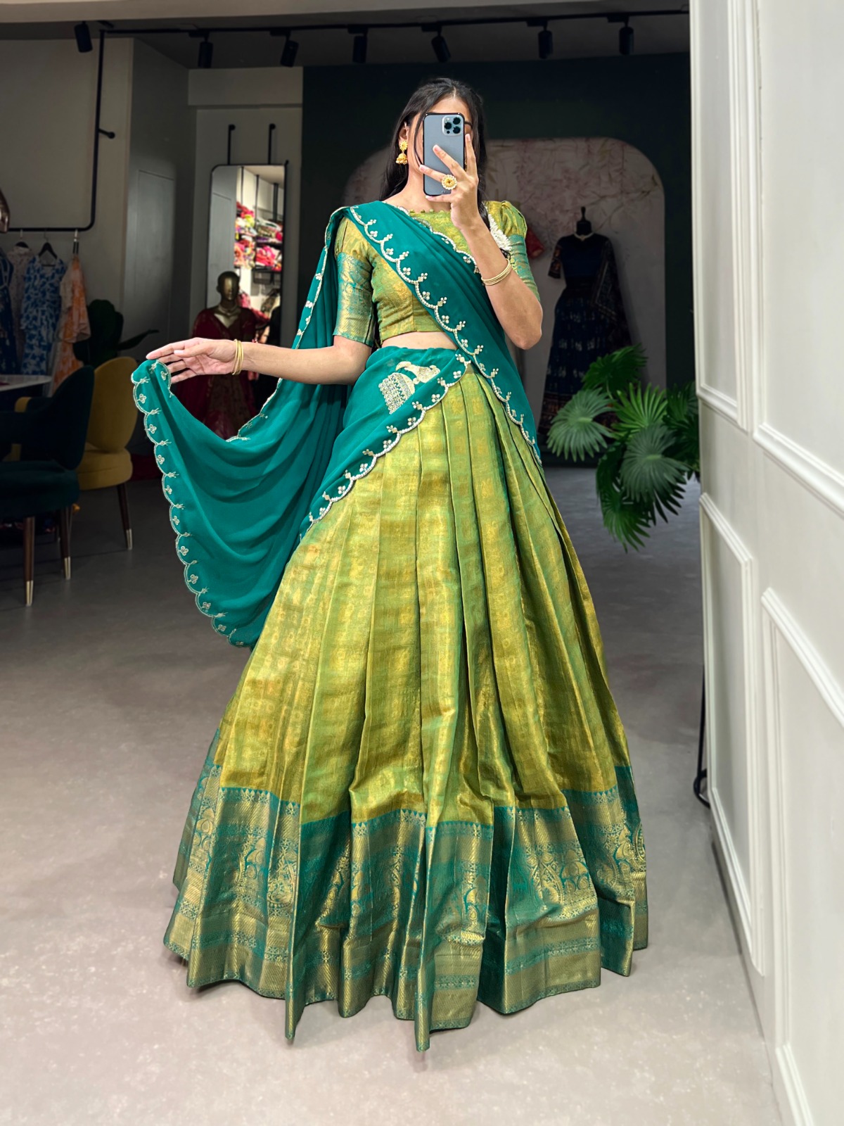 Experience the luxury of Kanjivaram silk in this regal lehenga choli ensemble, completed with a flowing embroidery dupatta.