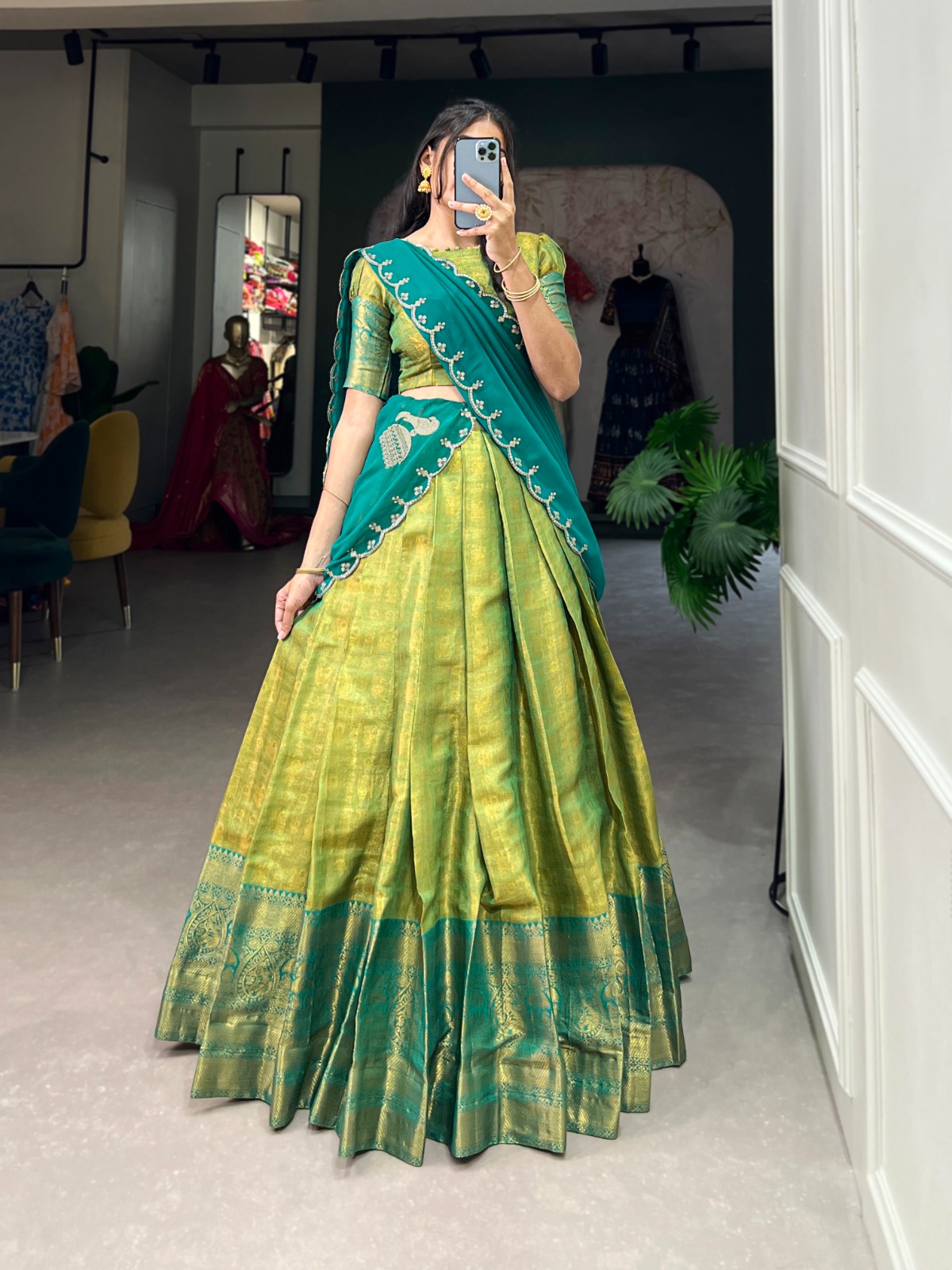 Experience the luxury of Kanjivaram silk in this regal lehenga choli ensemble, completed with a flowing embroidery dupatta.