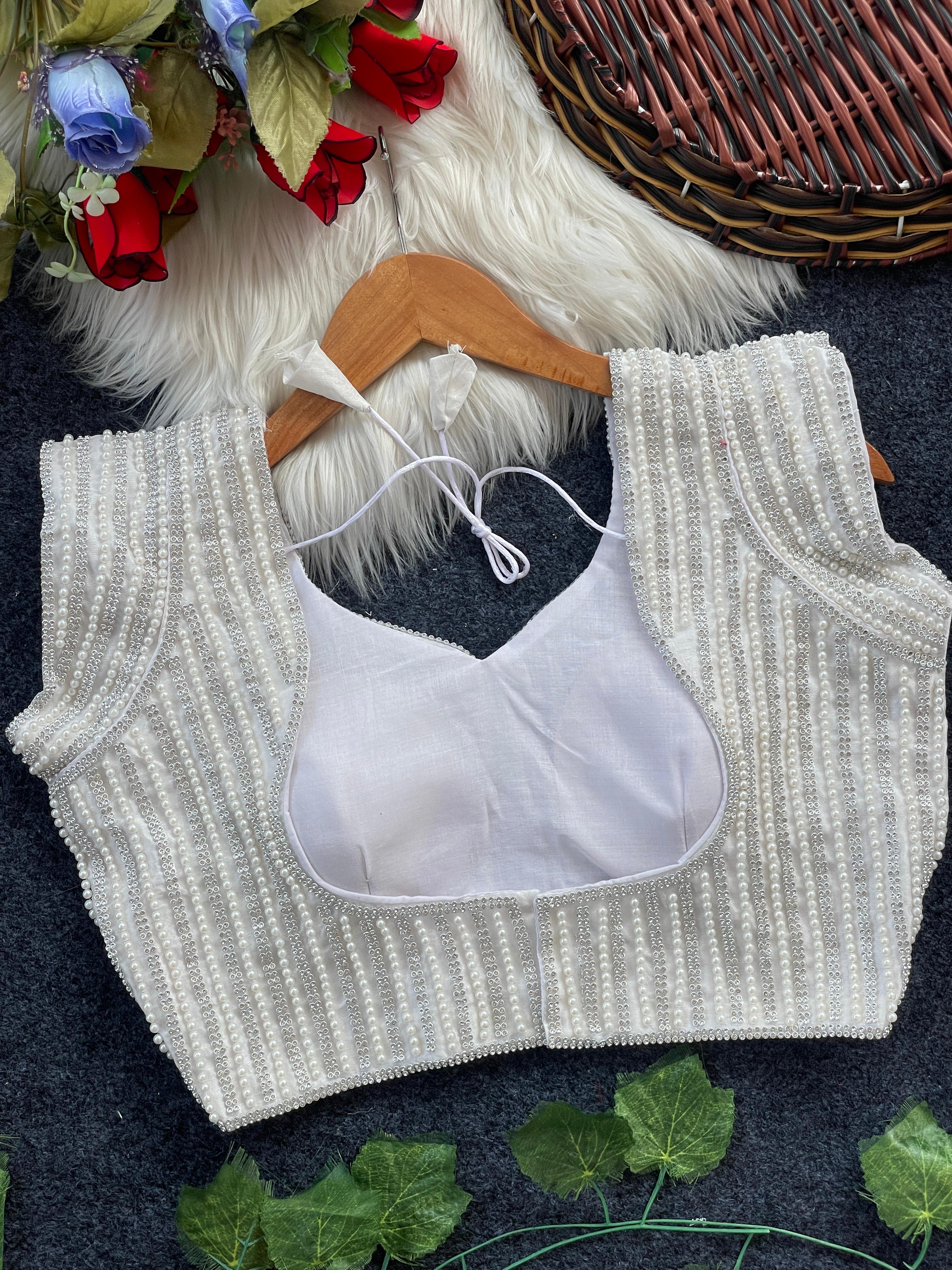 Presenting beautiful handcrafted pearl work in all over front and back of the blouse