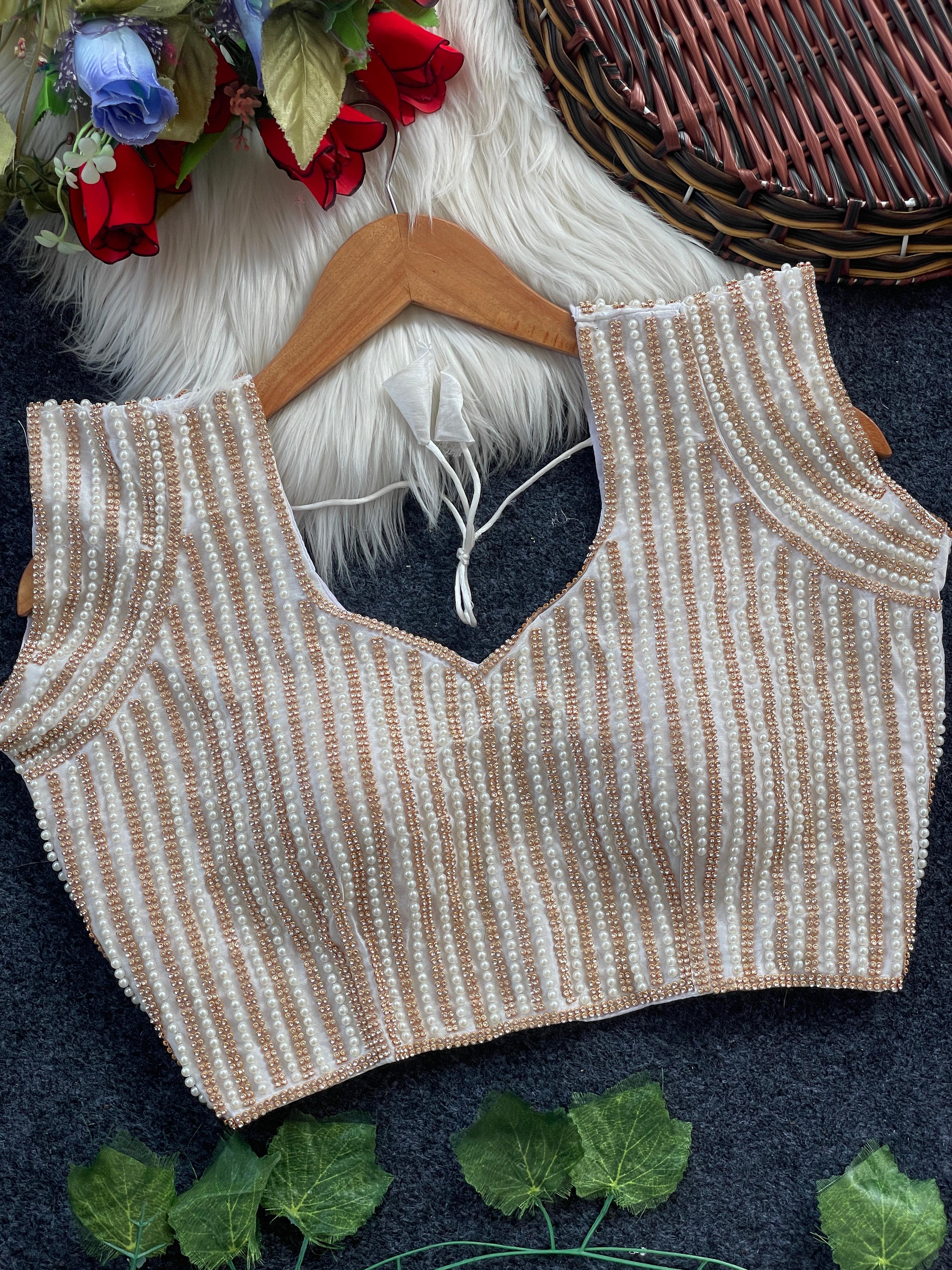 Presenting beautiful handcrafted pearl work in all over front and back of the blouse