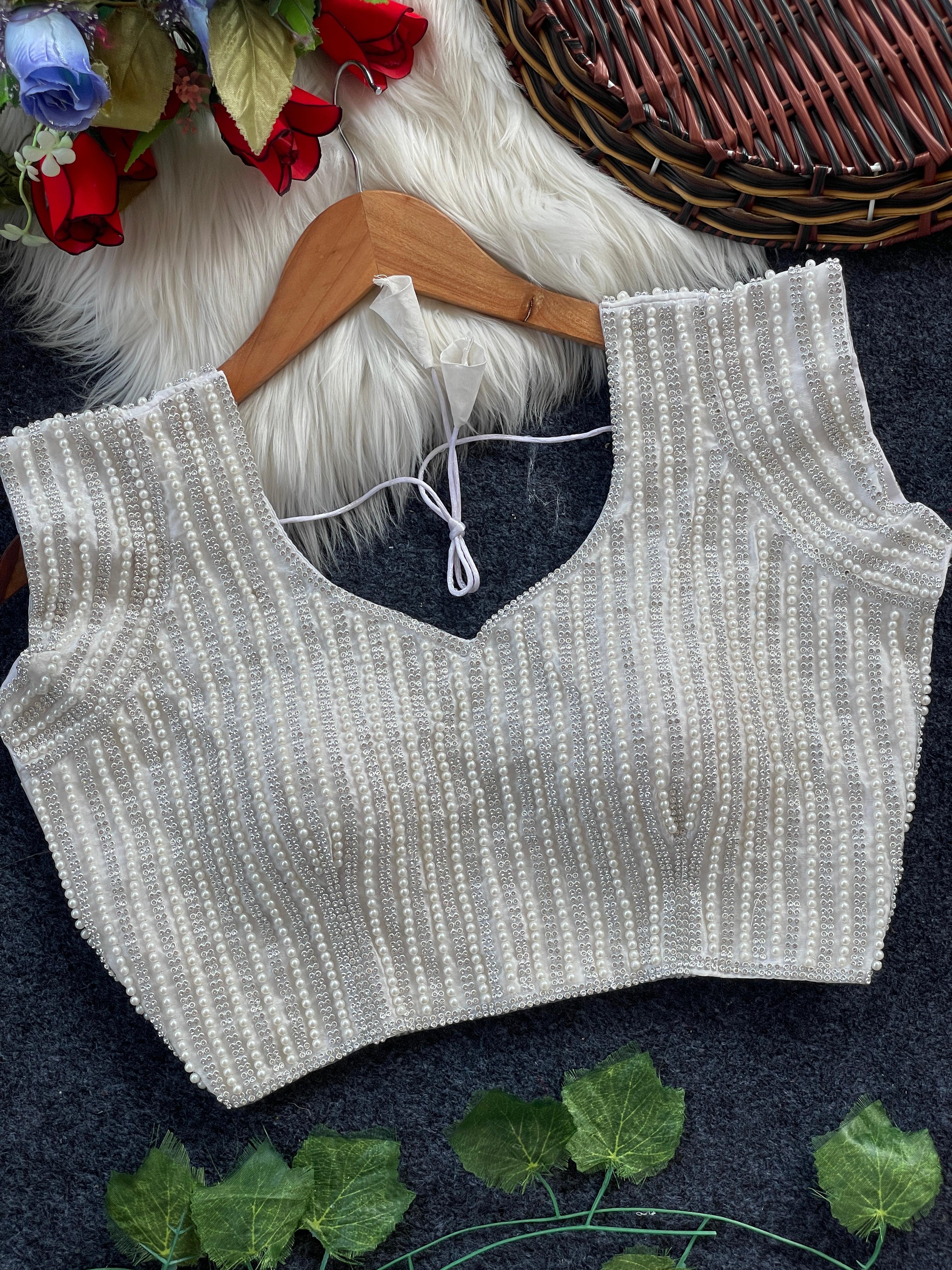 Presenting beautiful handcrafted pearl work in all over front and back of the blouse