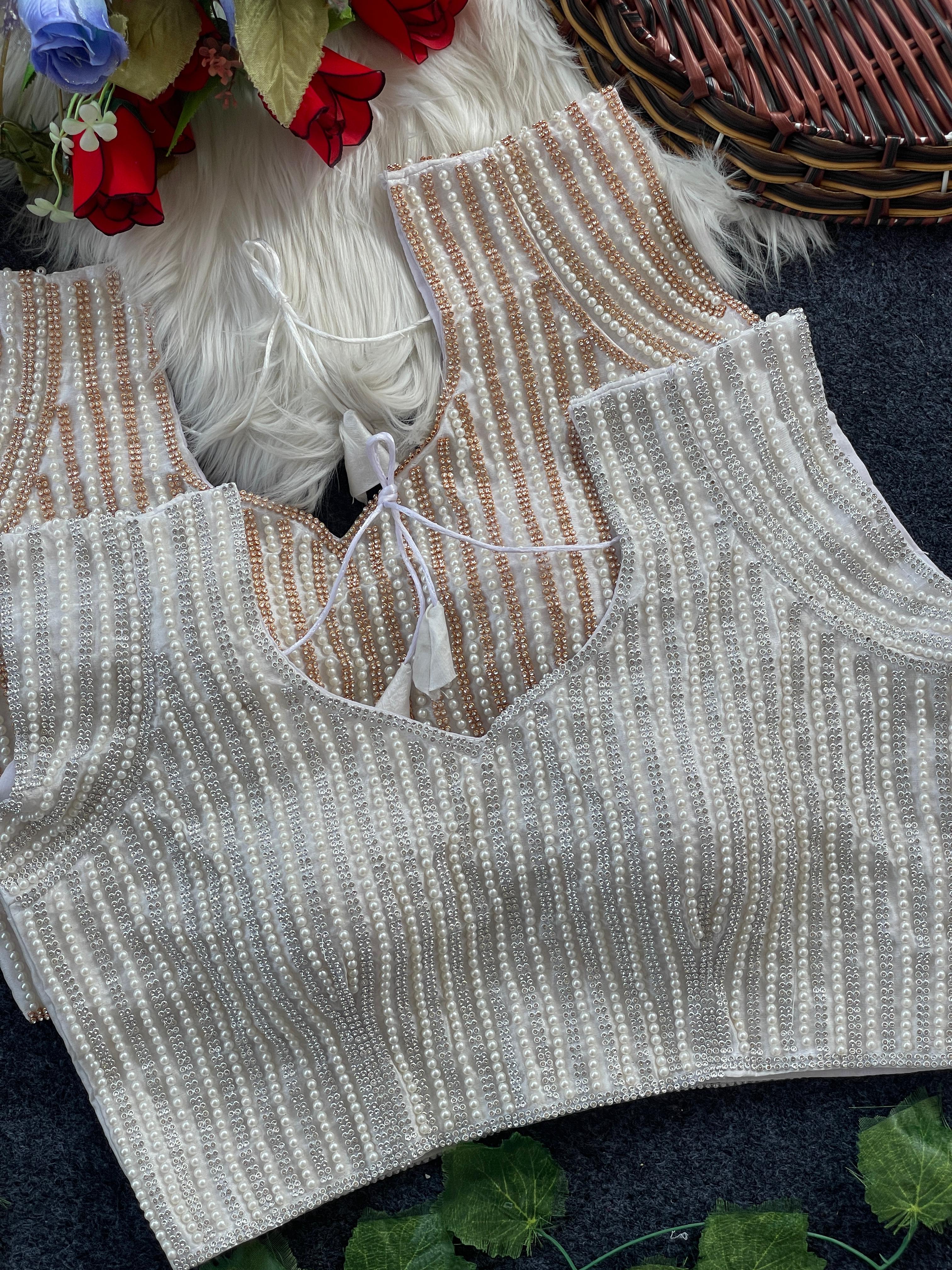 Presenting beautiful handcrafted pearl work in all over front and back of the blouse
