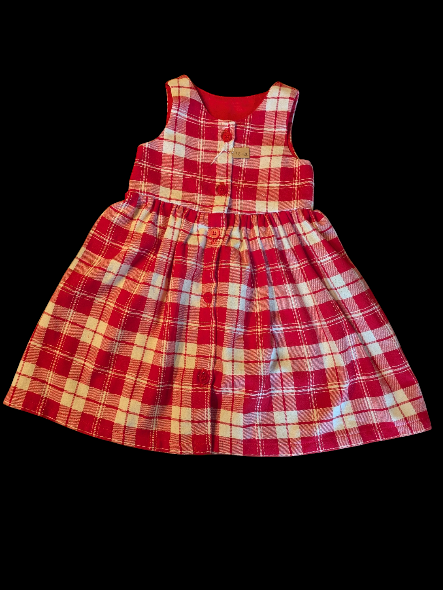 Red and white check with buttons down the front 1-2y