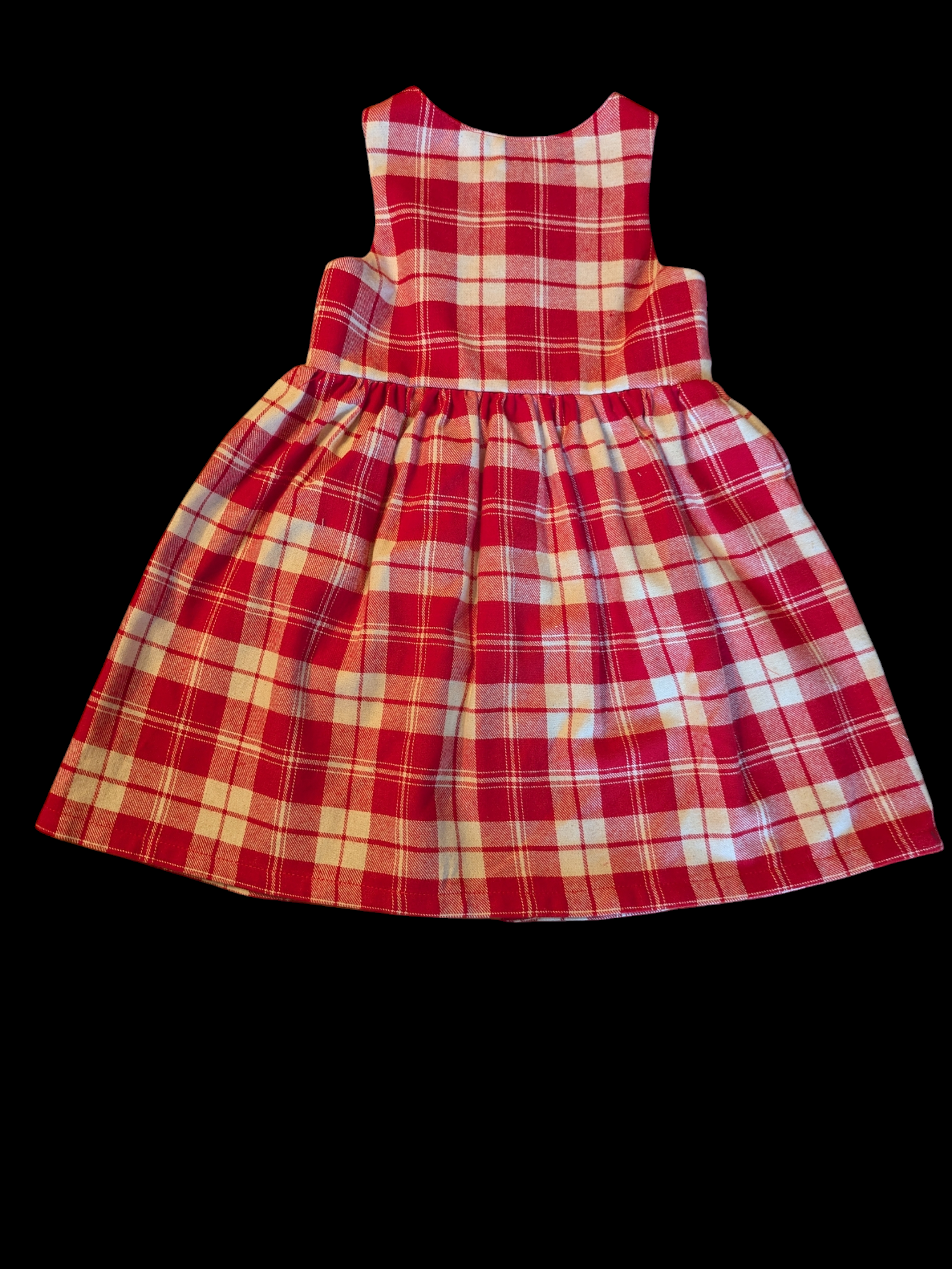 Red and white check with buttons down the front 1-2y
