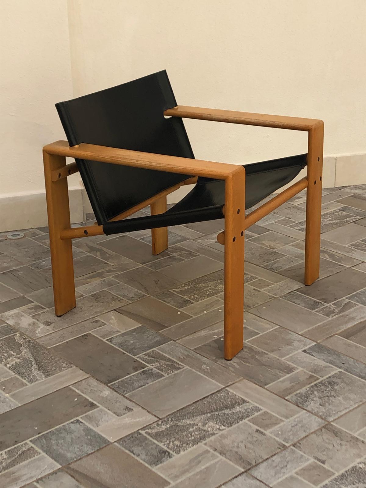 Tarcisio Colzani model Laser armchair in wood, and black leather, 1960