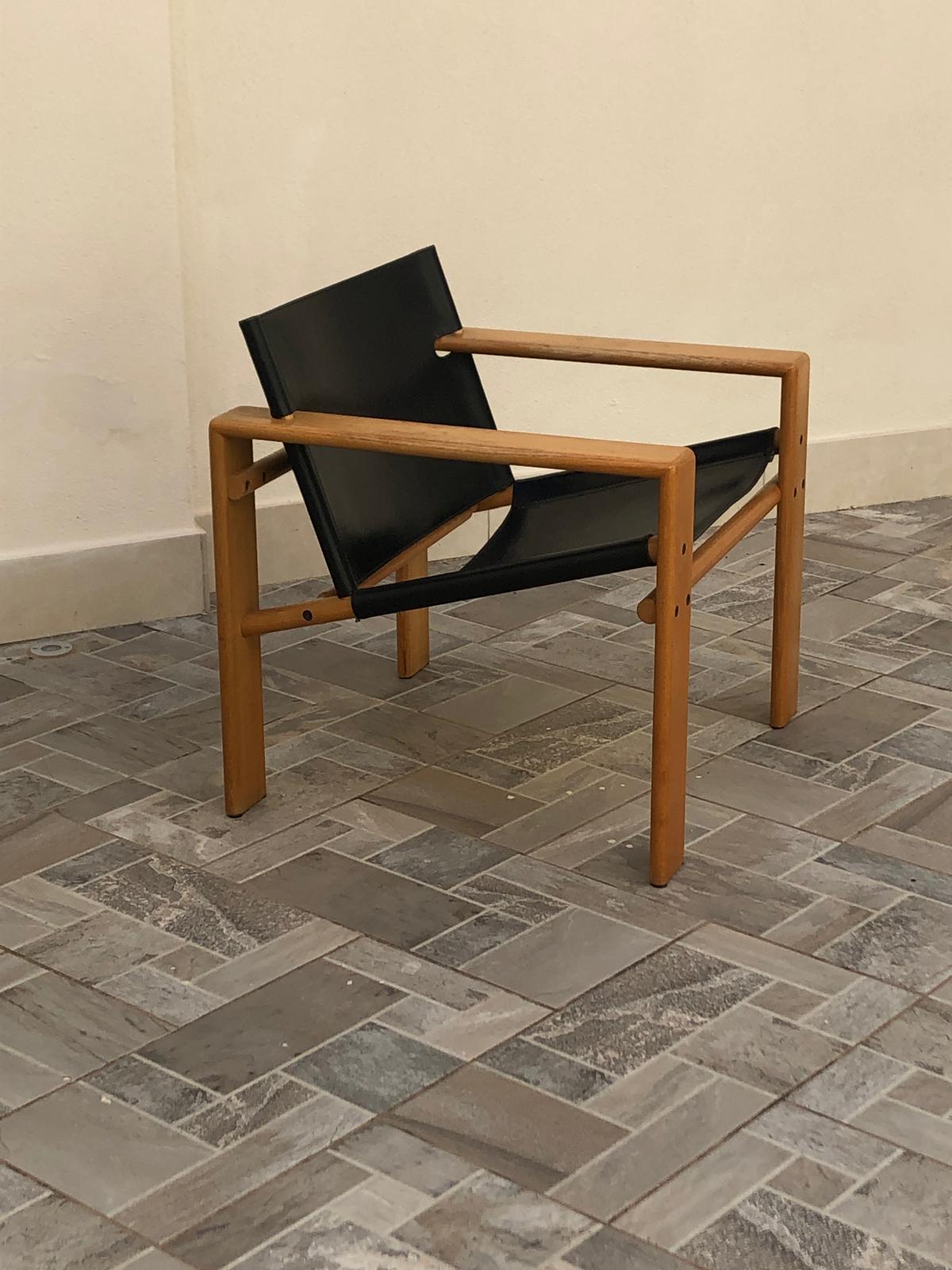Tarcisio Colzani model Laser armchair in wood, and black leather, 1960