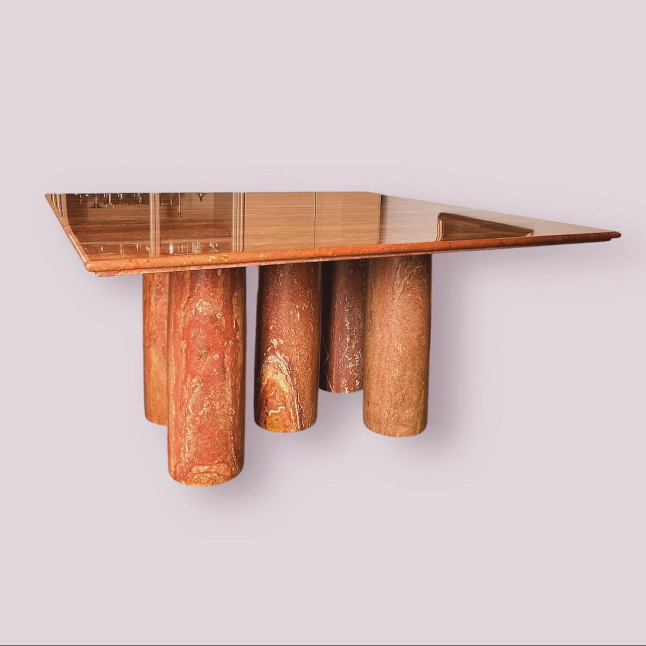 Mario Bellini 'll Colonato' Dining table, red travertine, Italy, 1970s.