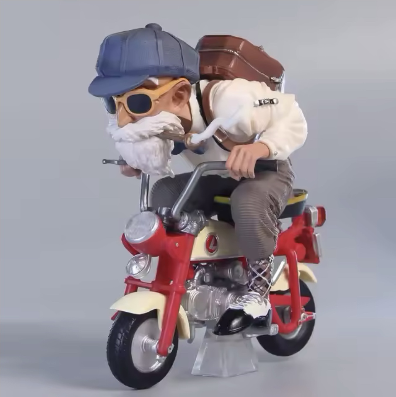 Figuras de Goku y Maestro Roshi en motocicleta