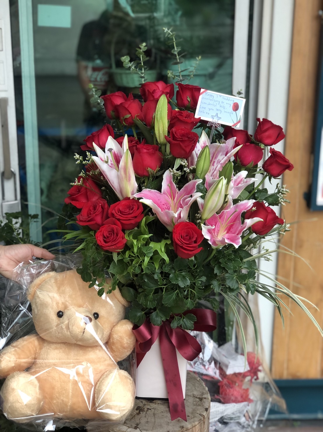 Rose and Lily Flower Arrangement with Teddy Bear
