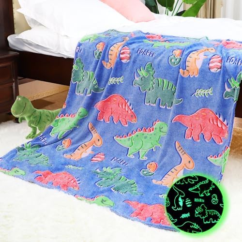 Cobija de dinosaurios que brilla en la oscuridad