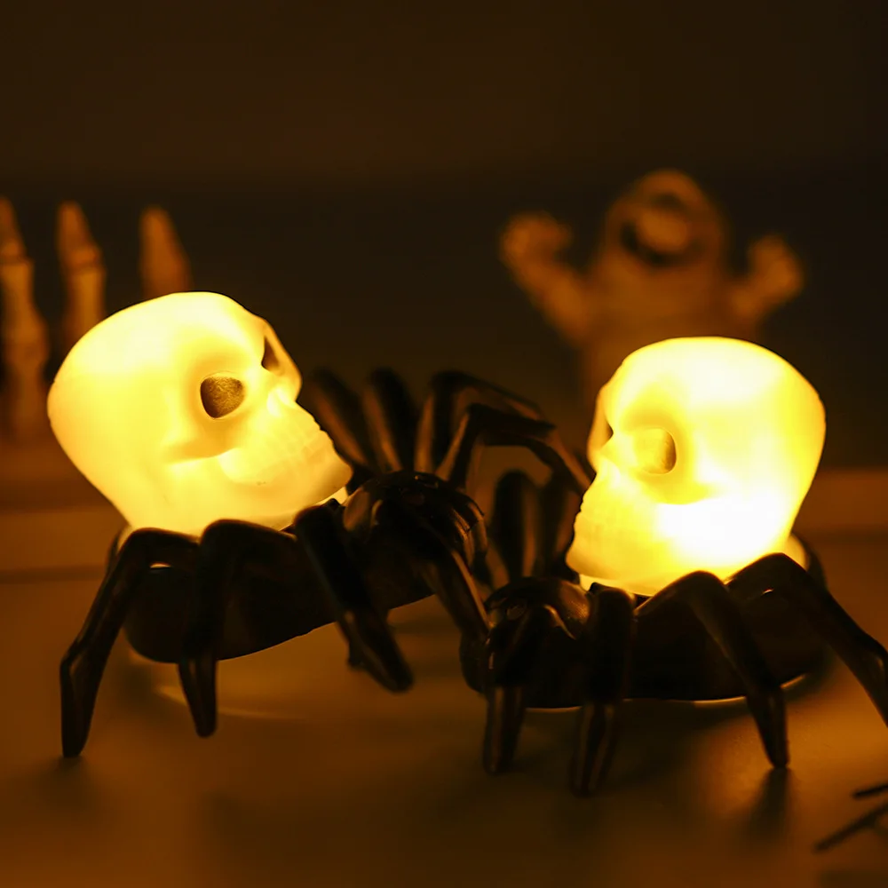 Araña porta velas de Calavera y Vela naranja