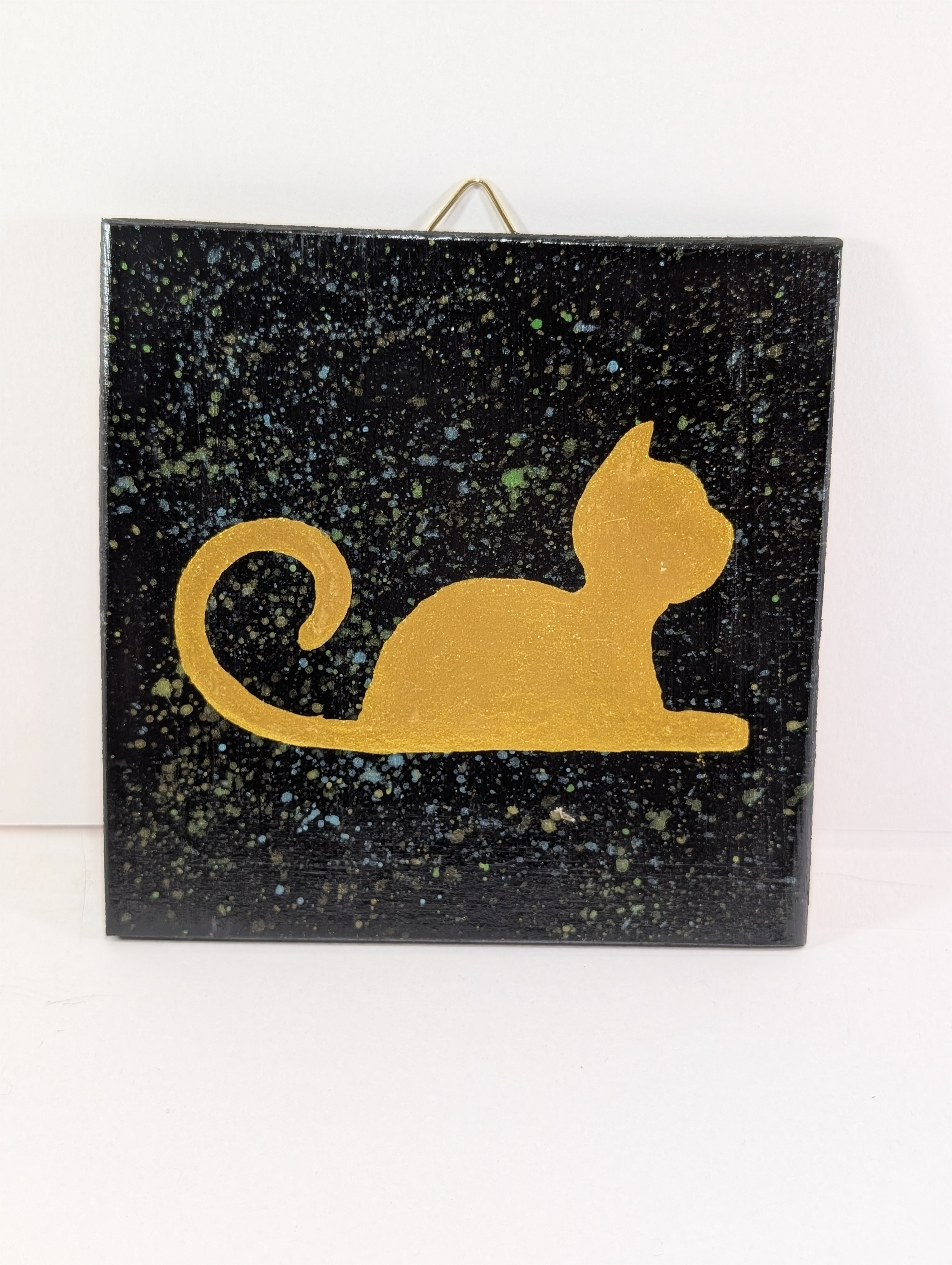 Kattekunst på treplate