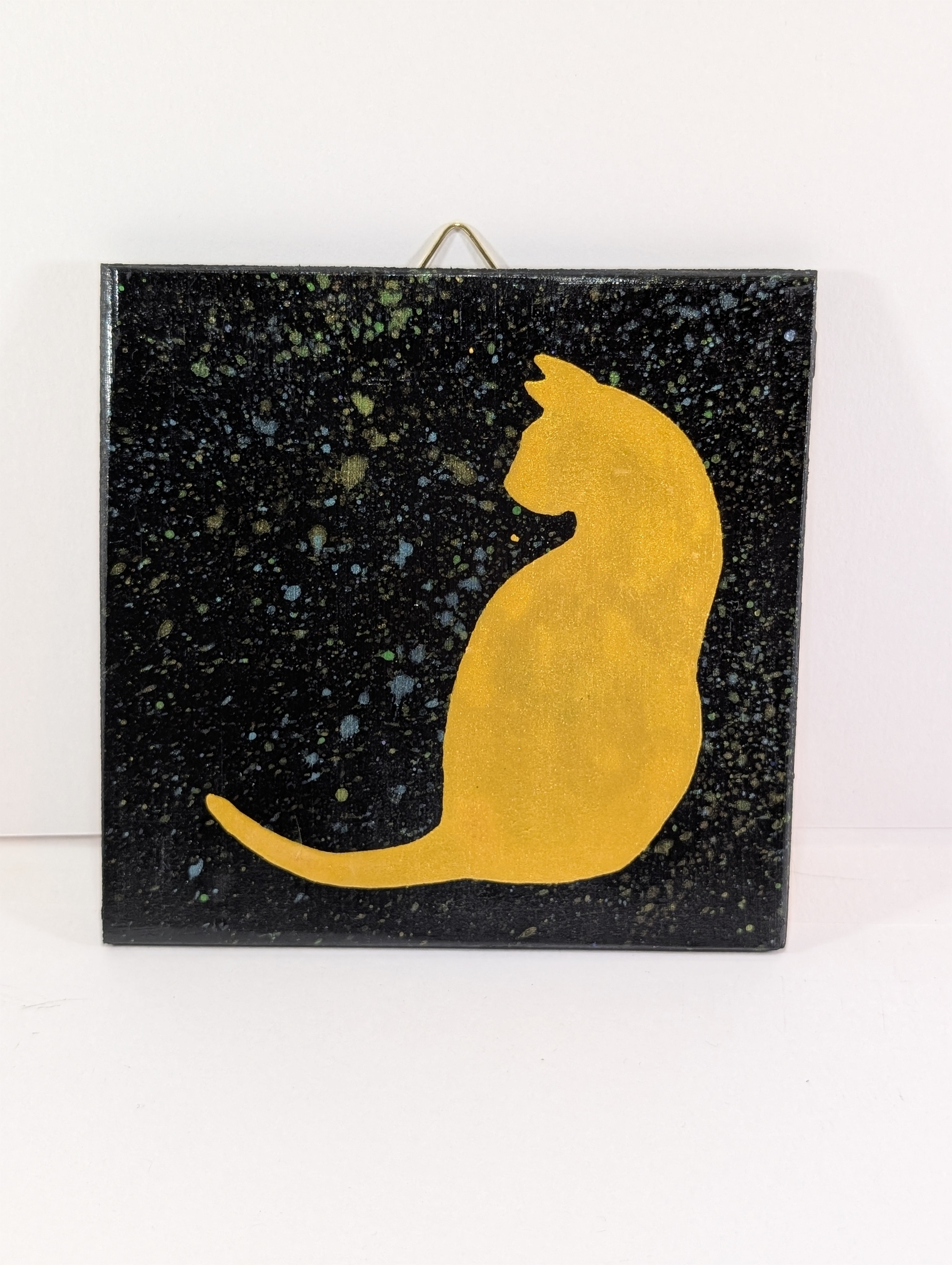 Kattekunst på treplate