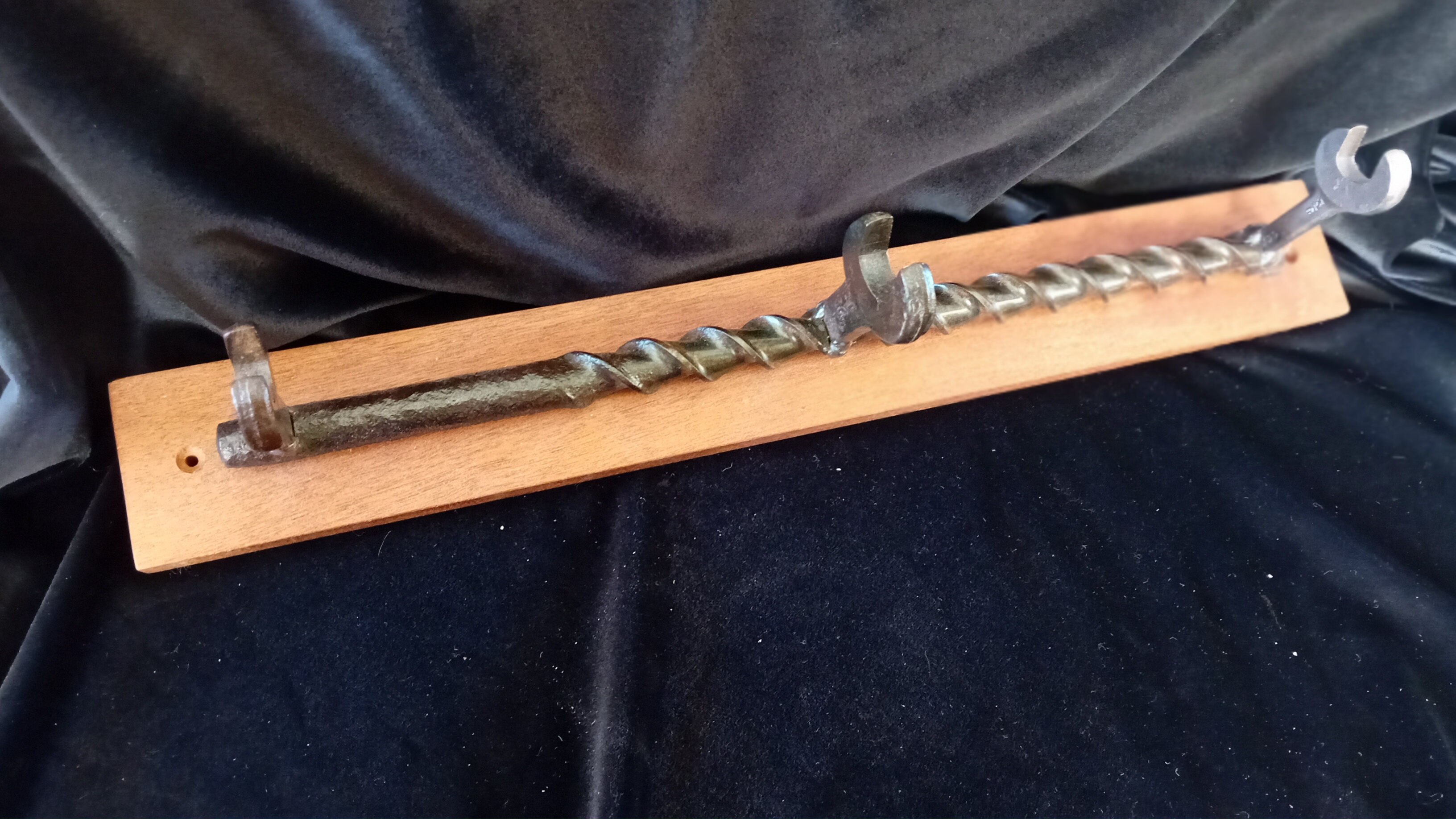 Drill bit and spanner coat hooks