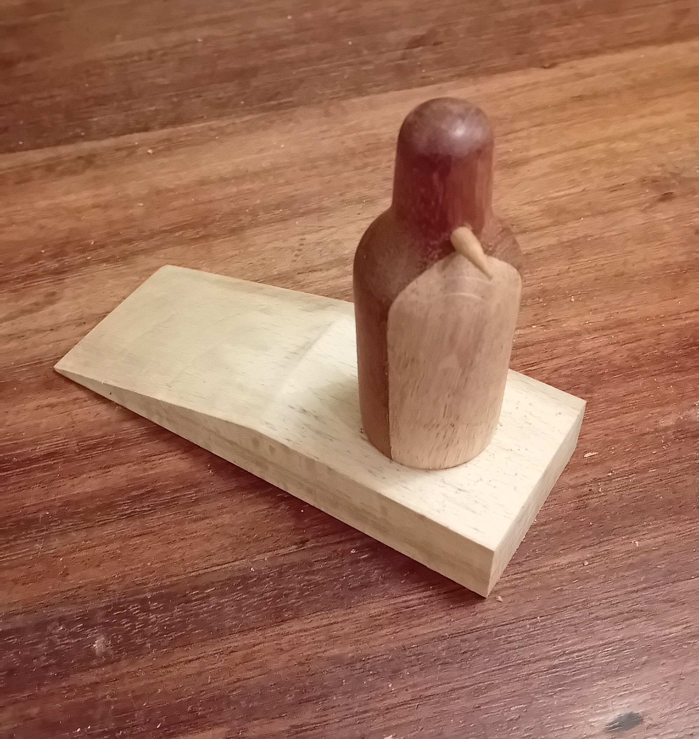 Cute wooden penguin doorstops
