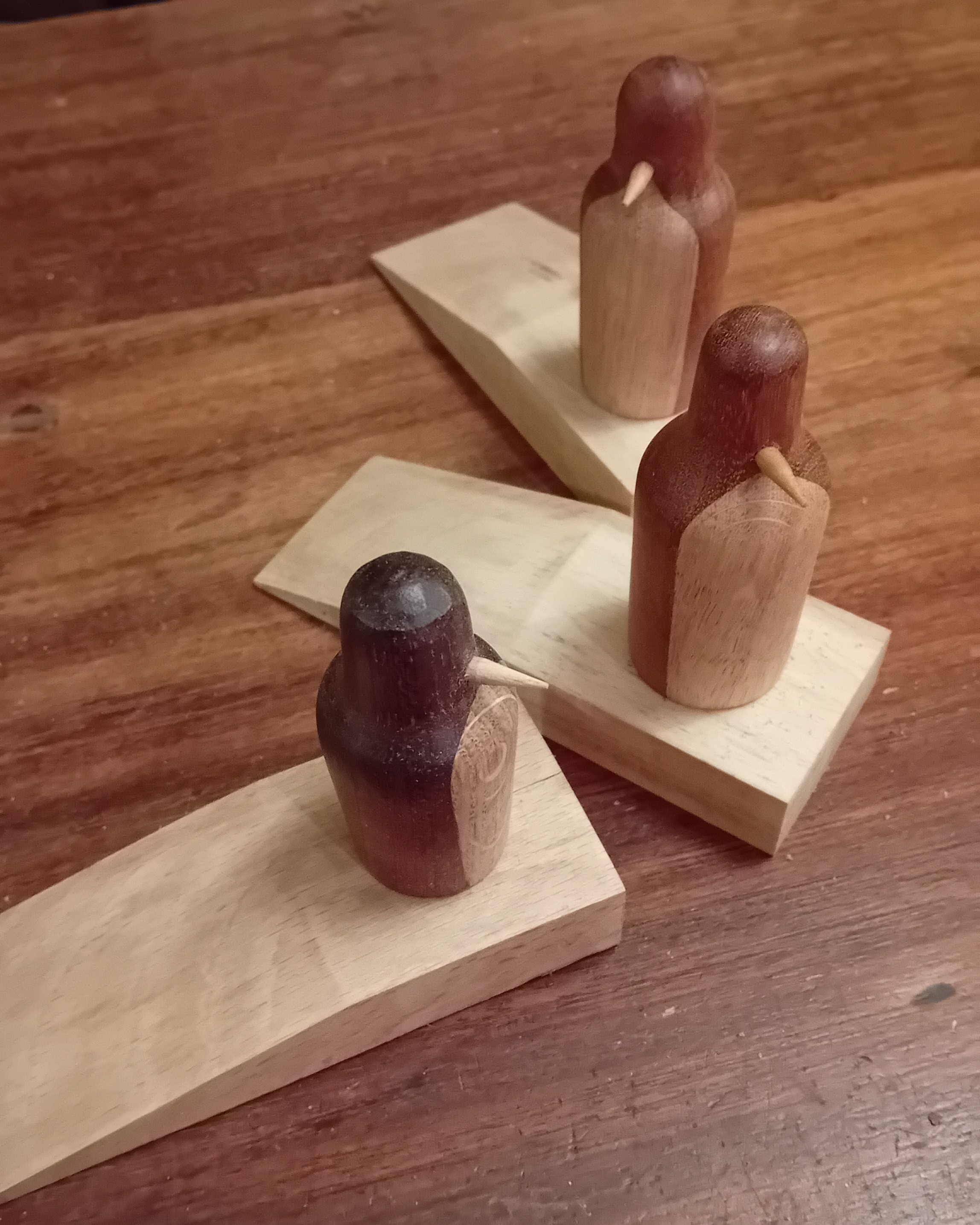 Cute wooden penguin doorstops