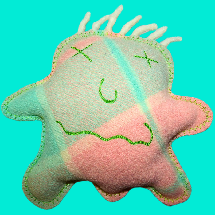 Cuddle Monster, medium green, purple & blue with spiky hair