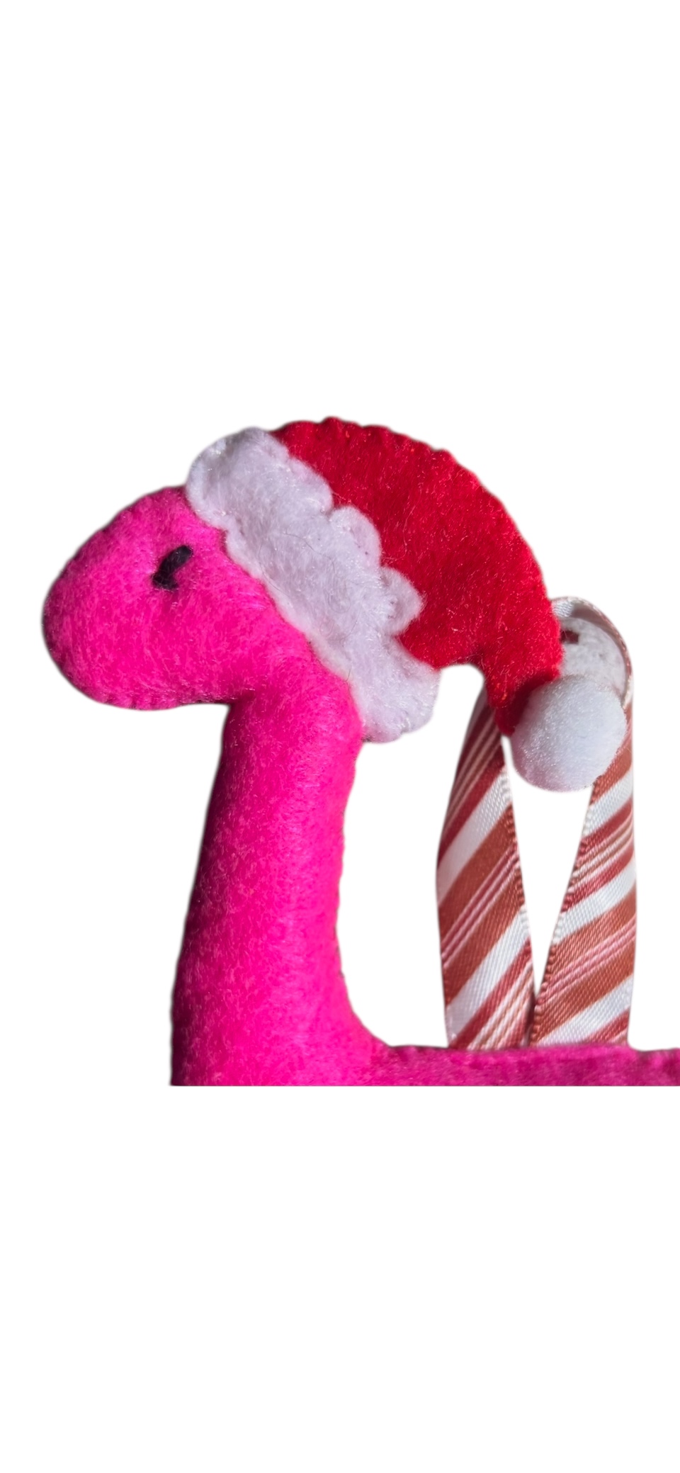 Handmade felt Christmas Dinosaur with Santa hat on.