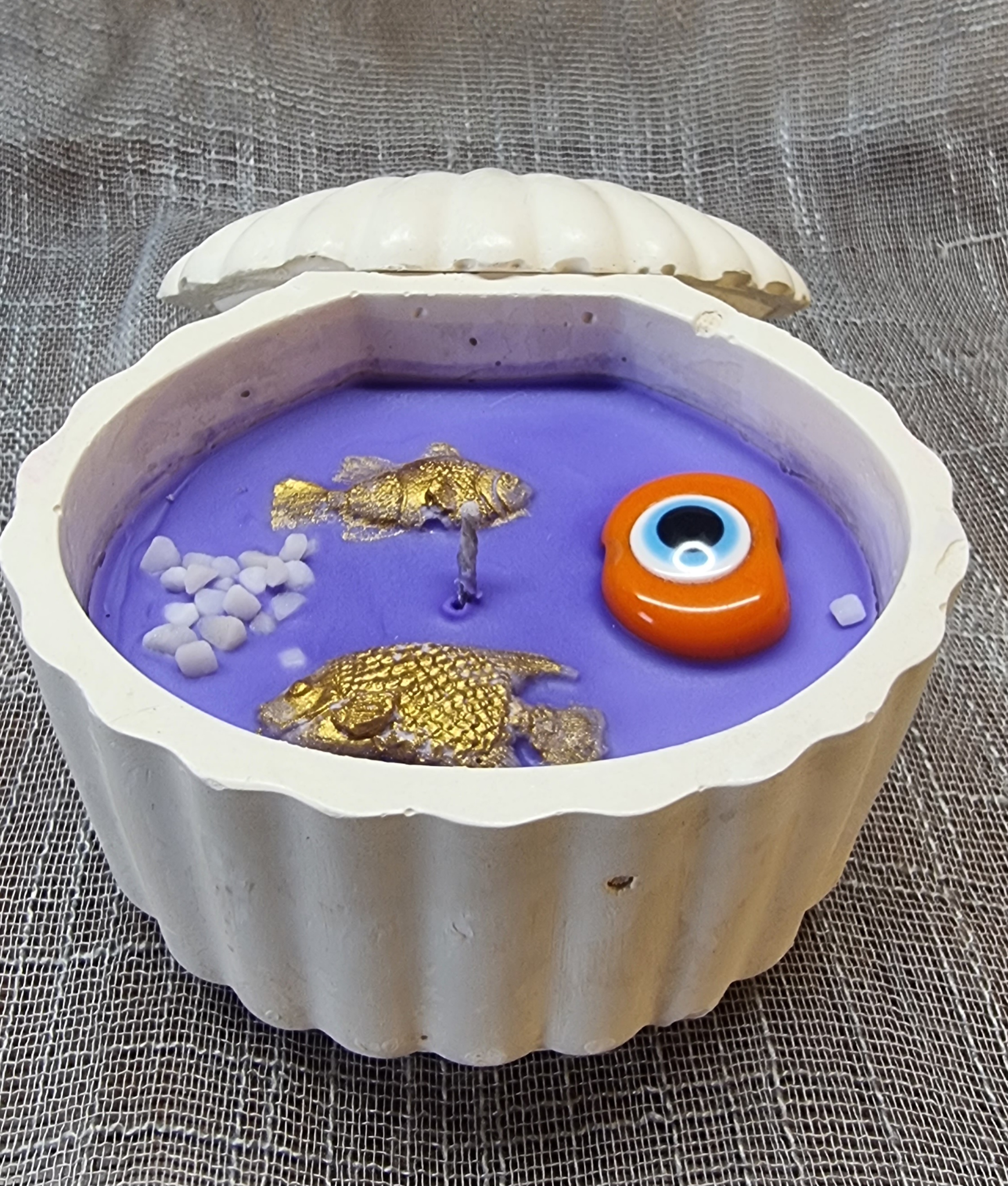 Purple wax in a handmade seashell (violet scented)