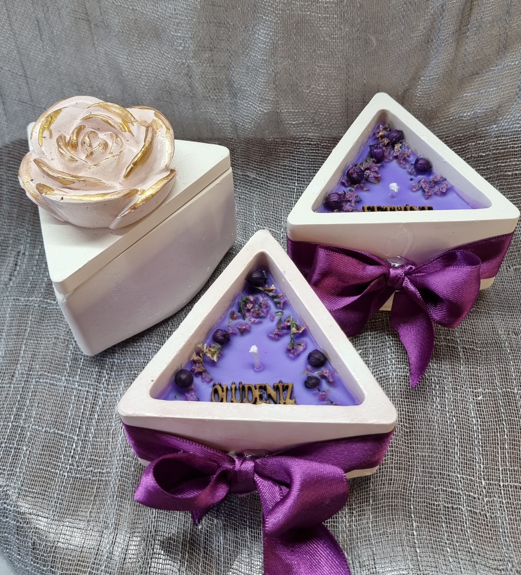 Purple wax in a triangular container (lavender scented)