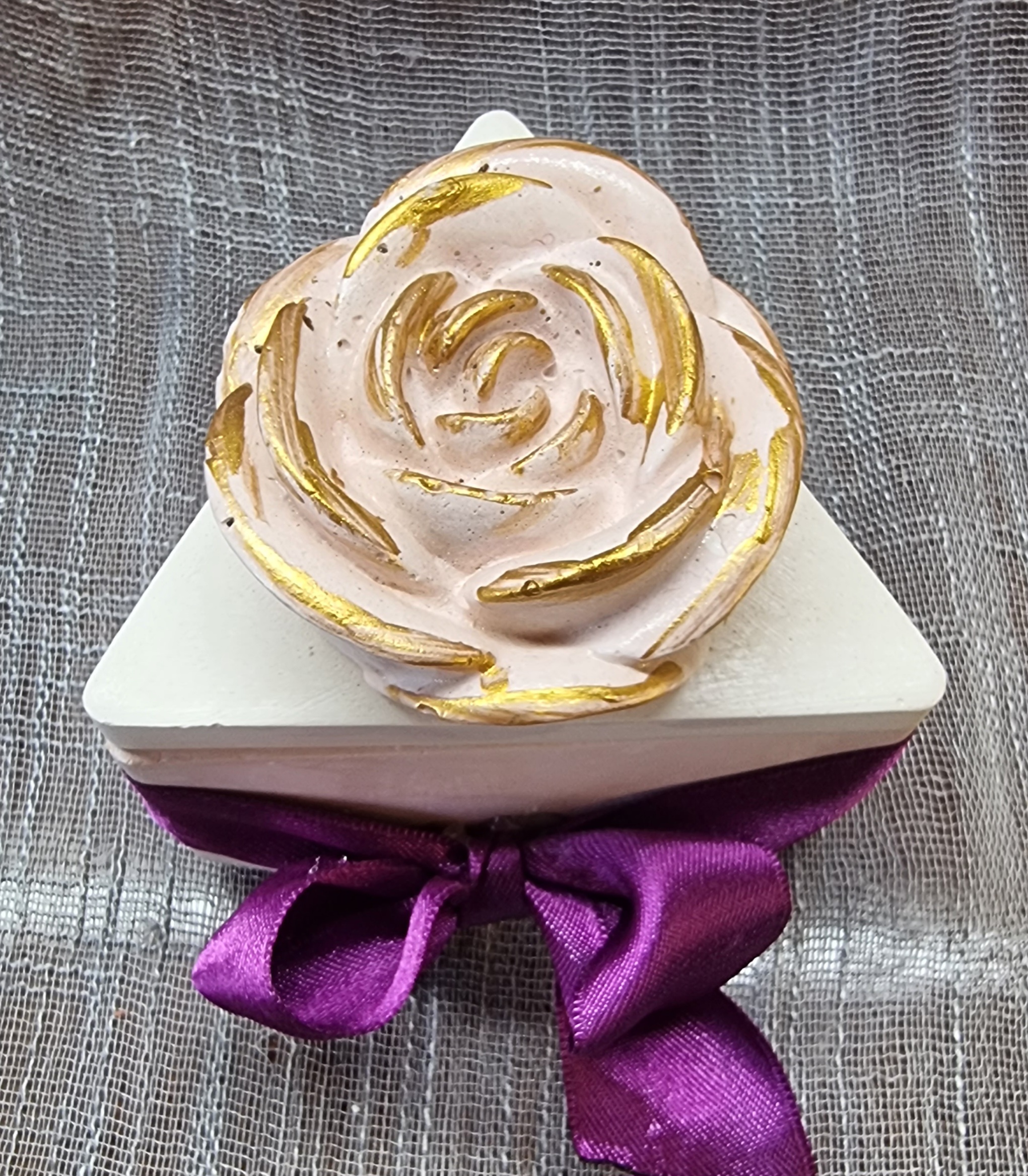 Purple wax in a triangular container (lavender scented)