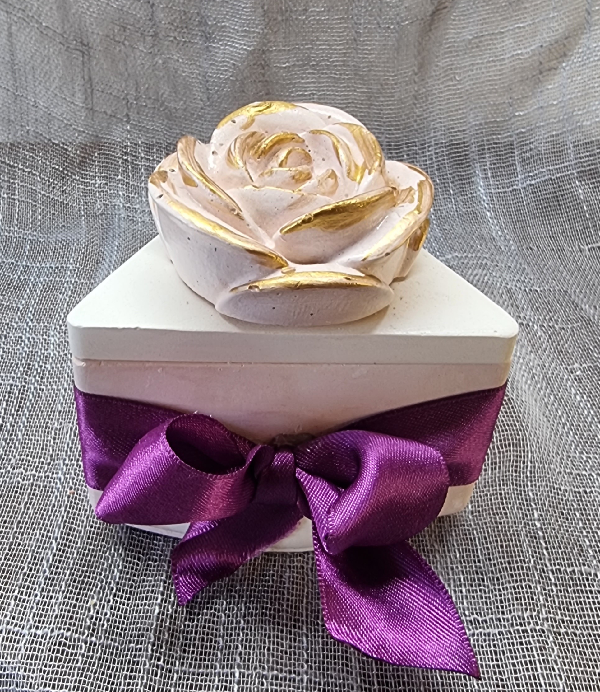 Purple wax in a triangular container (lavender scented)