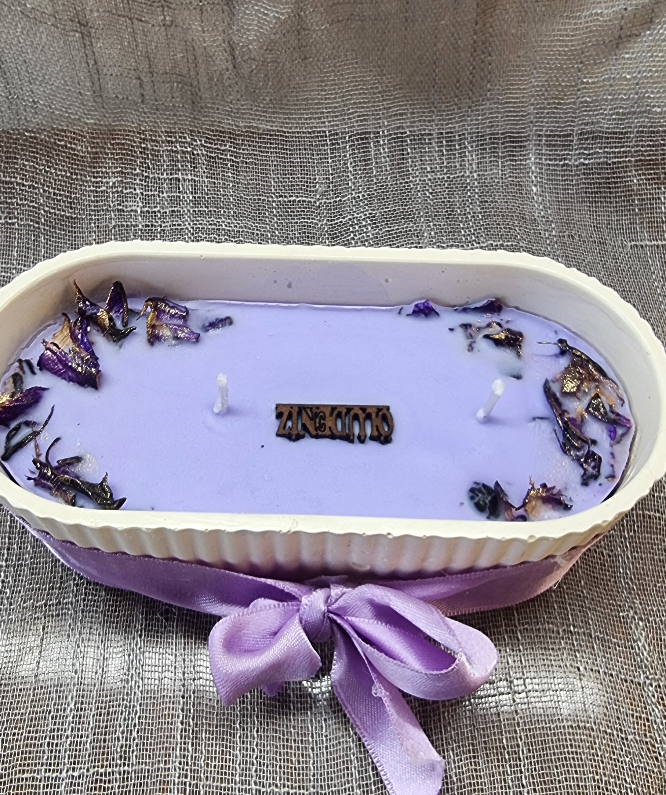 Big-sized oval candle with purple wax (lavender scent)