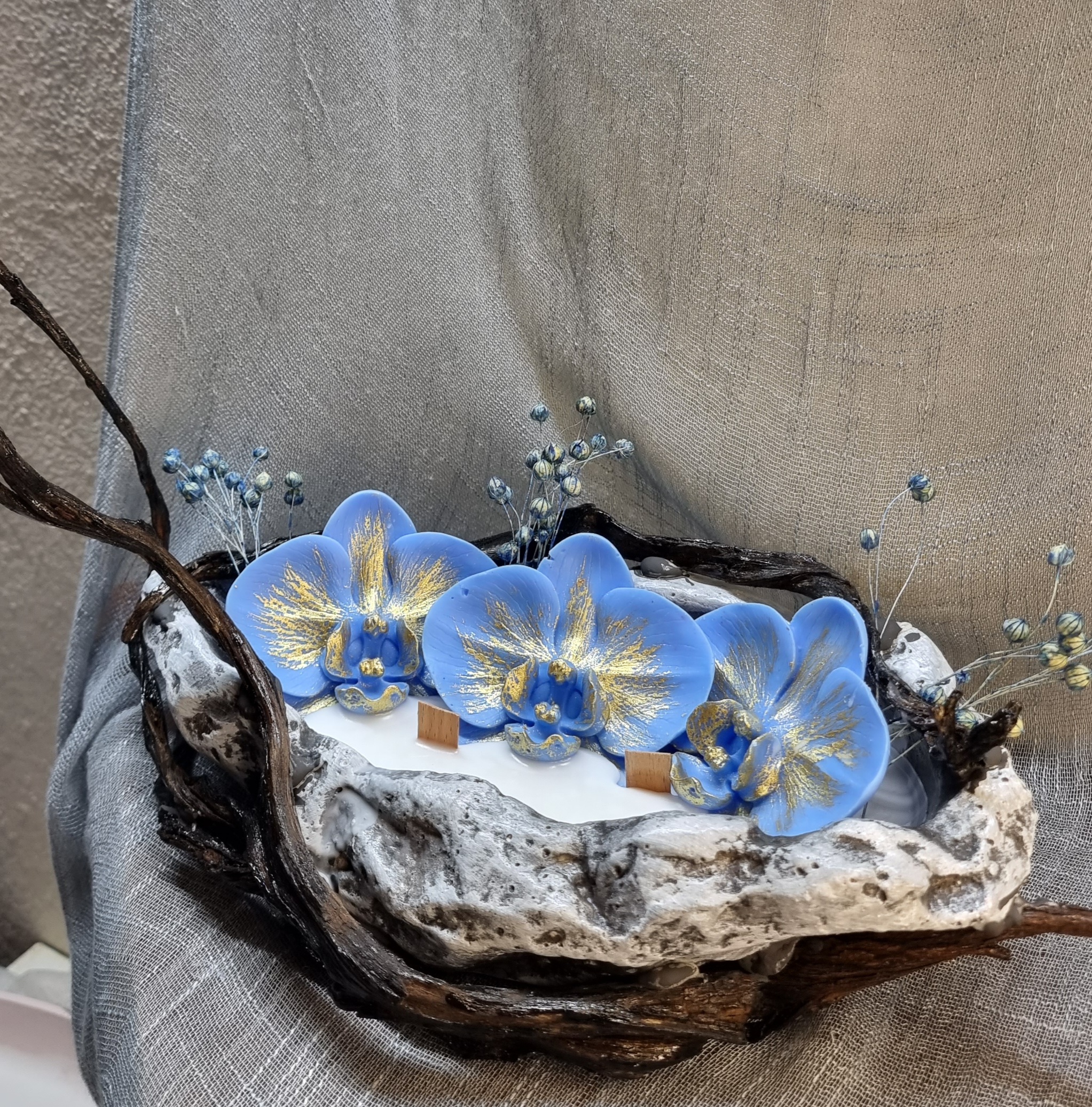 King-size candle with blue wax orchids 