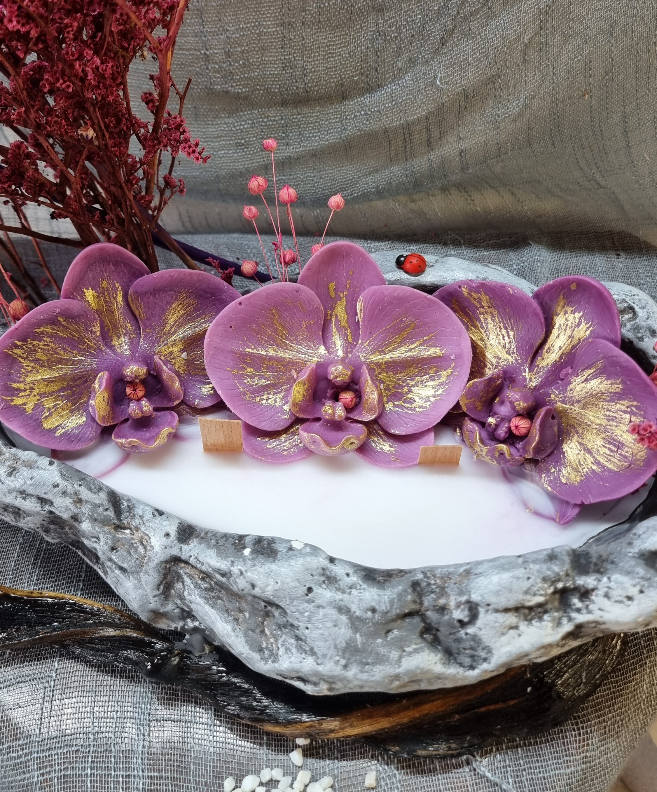 King-size candle with dark-pink wax orchids