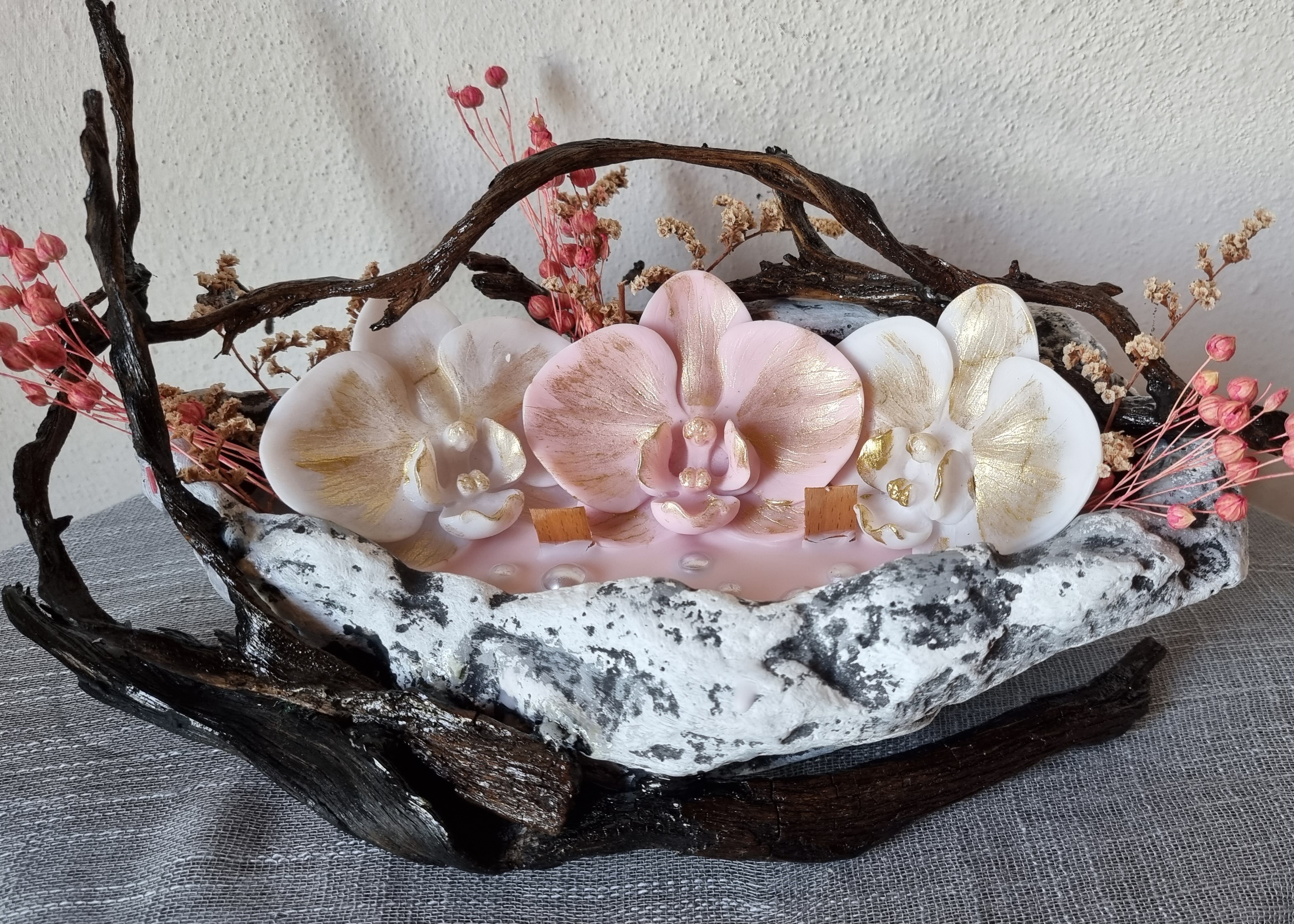 King-size candle with white and pink wax orchids