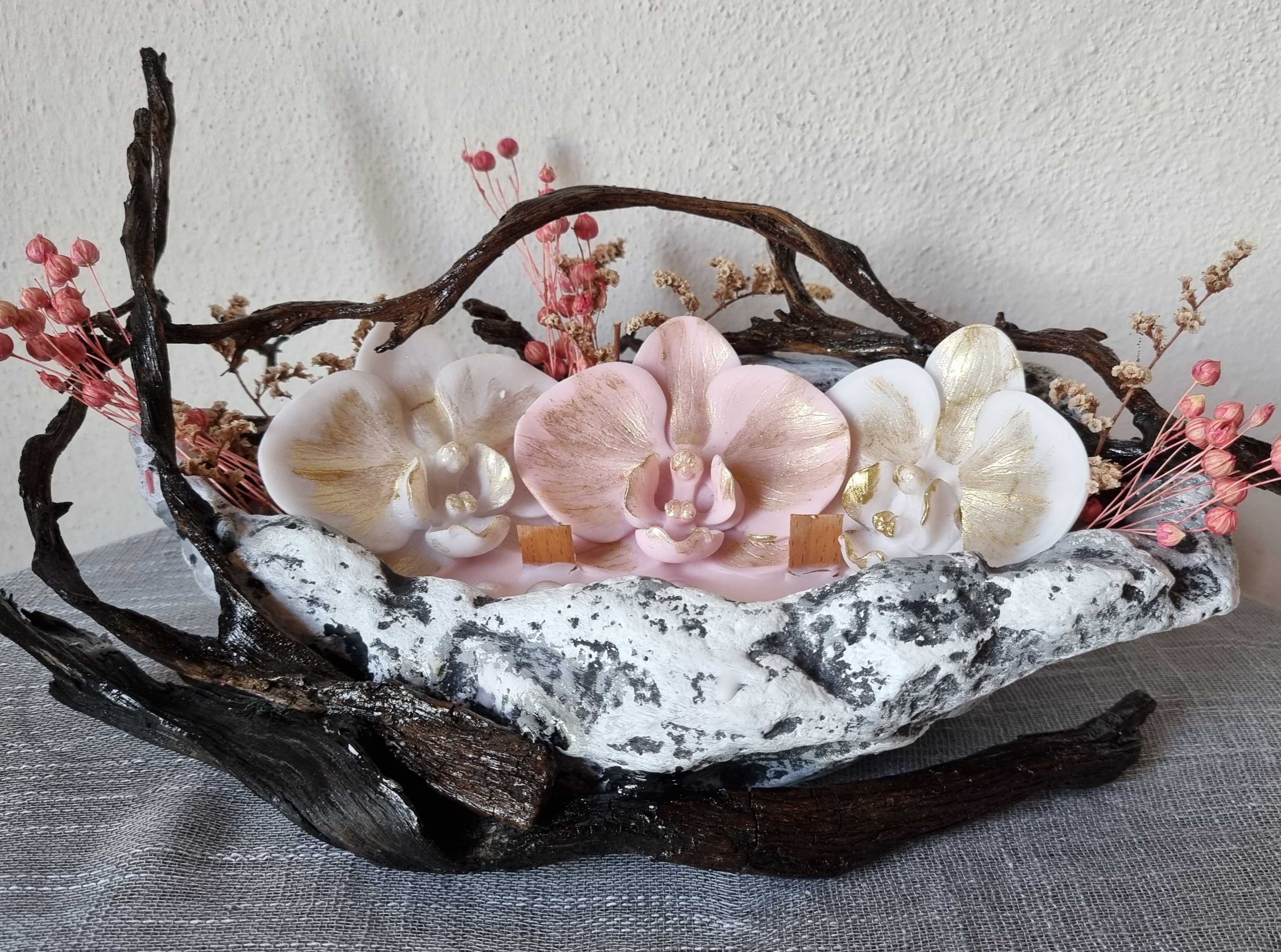 King-size candle with white and pink wax orchids 