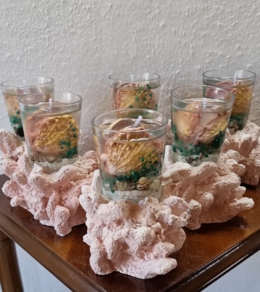 Transparent candle in a glass on top of a coral