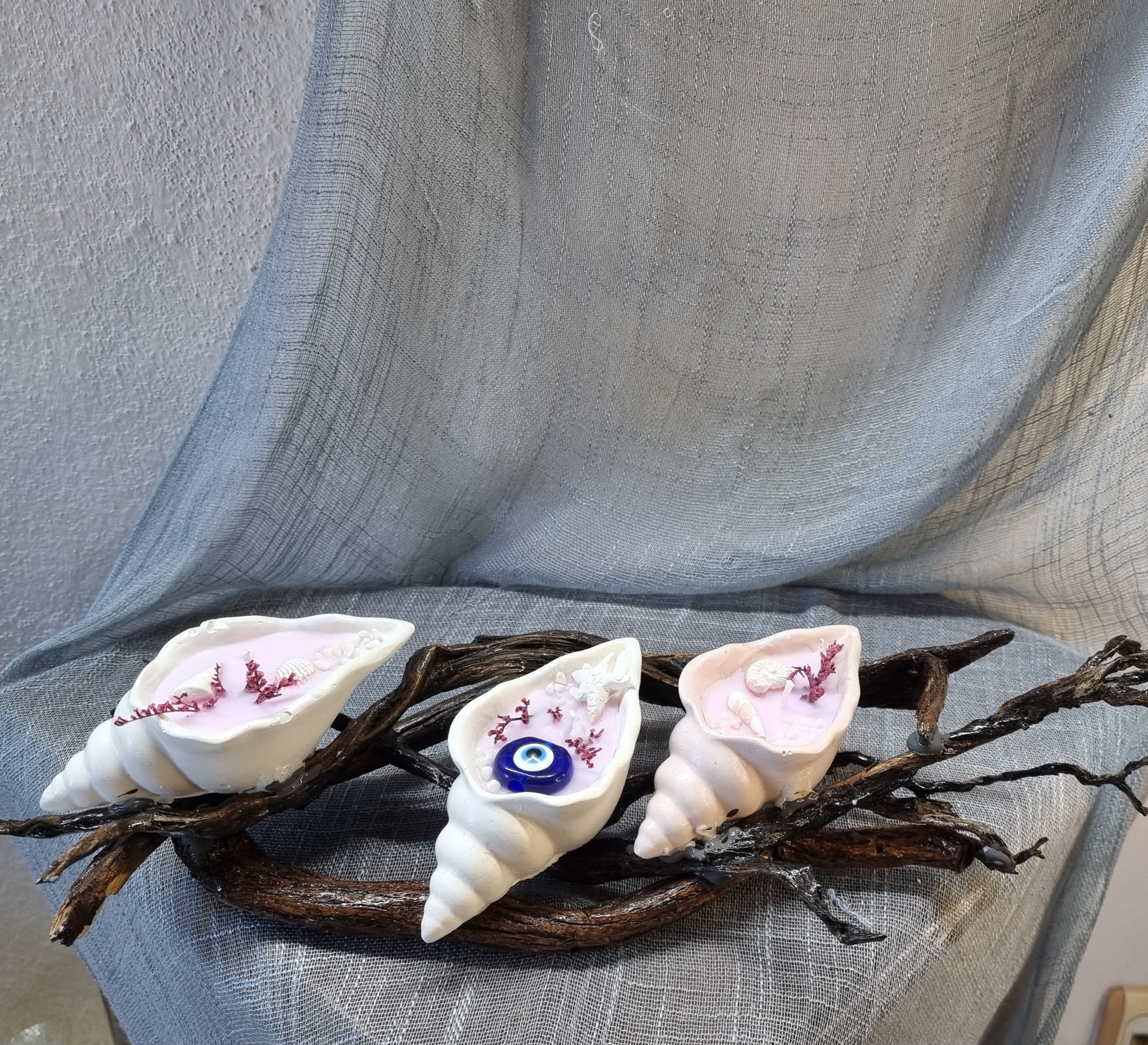 Three small handmade seashells on wooden base (vanilla or pomegranate scent)