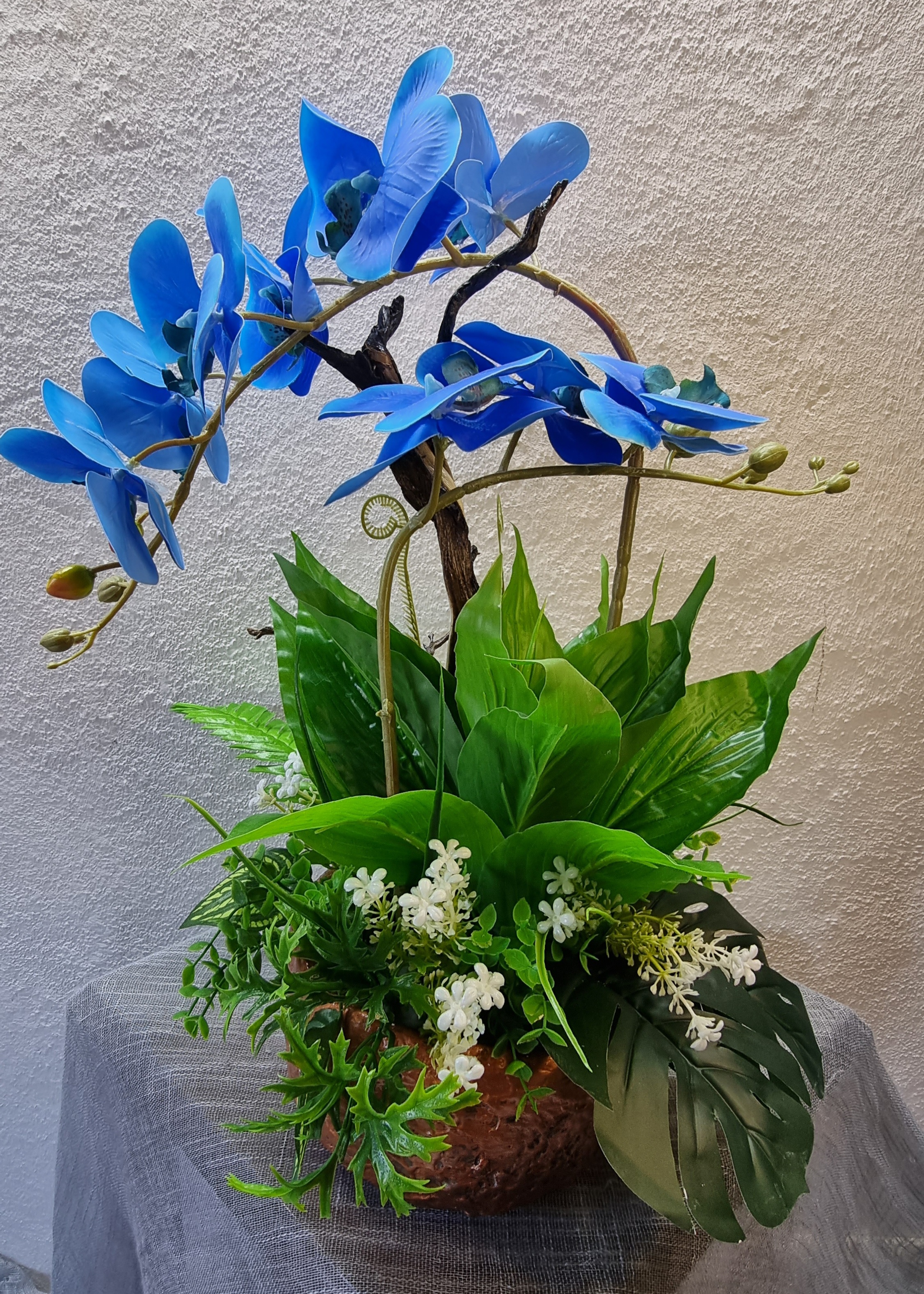 Big-size copper-colour planter with artificial blue orchids