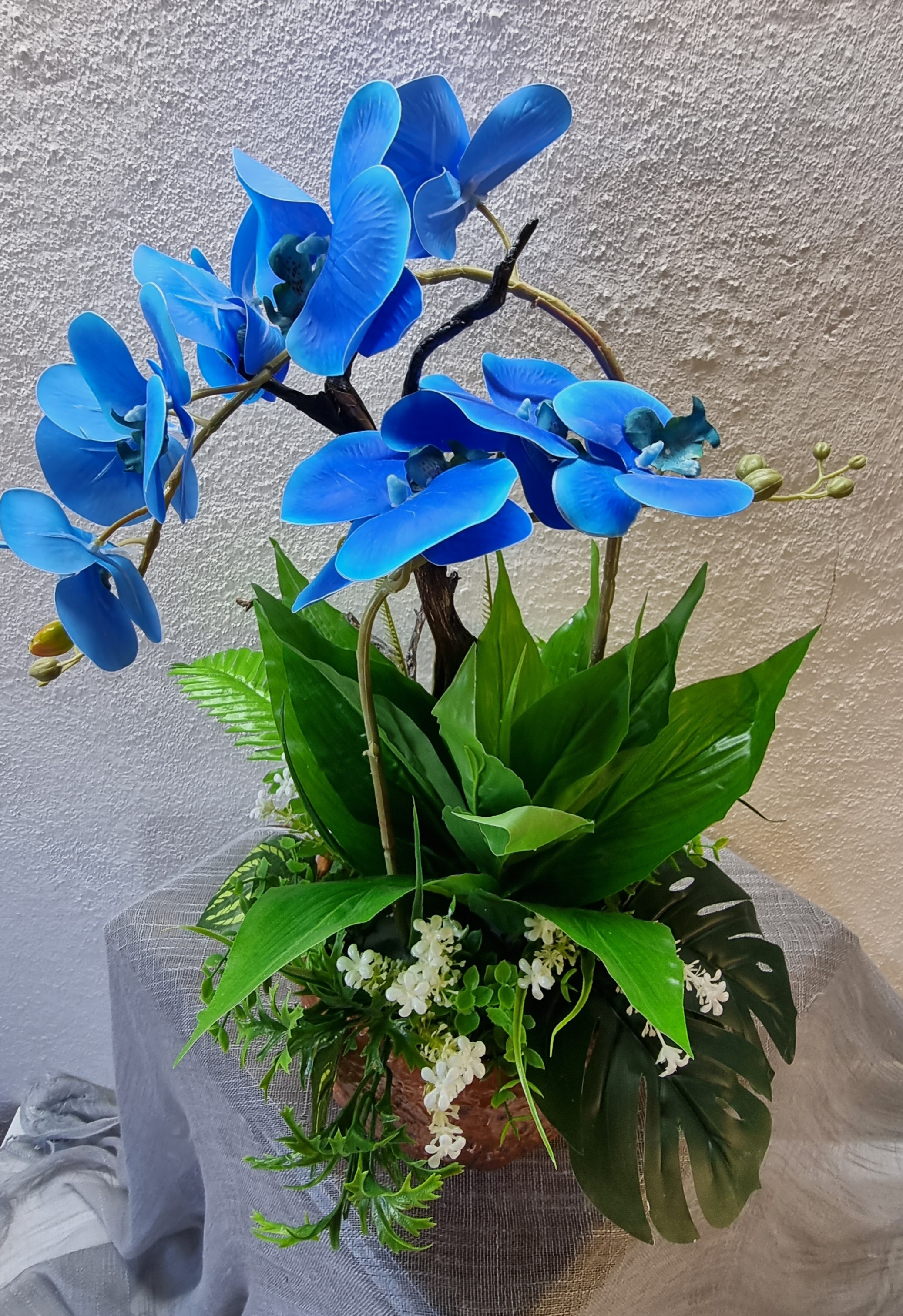 Big-size copper-colour planter with artificial blue orchids 