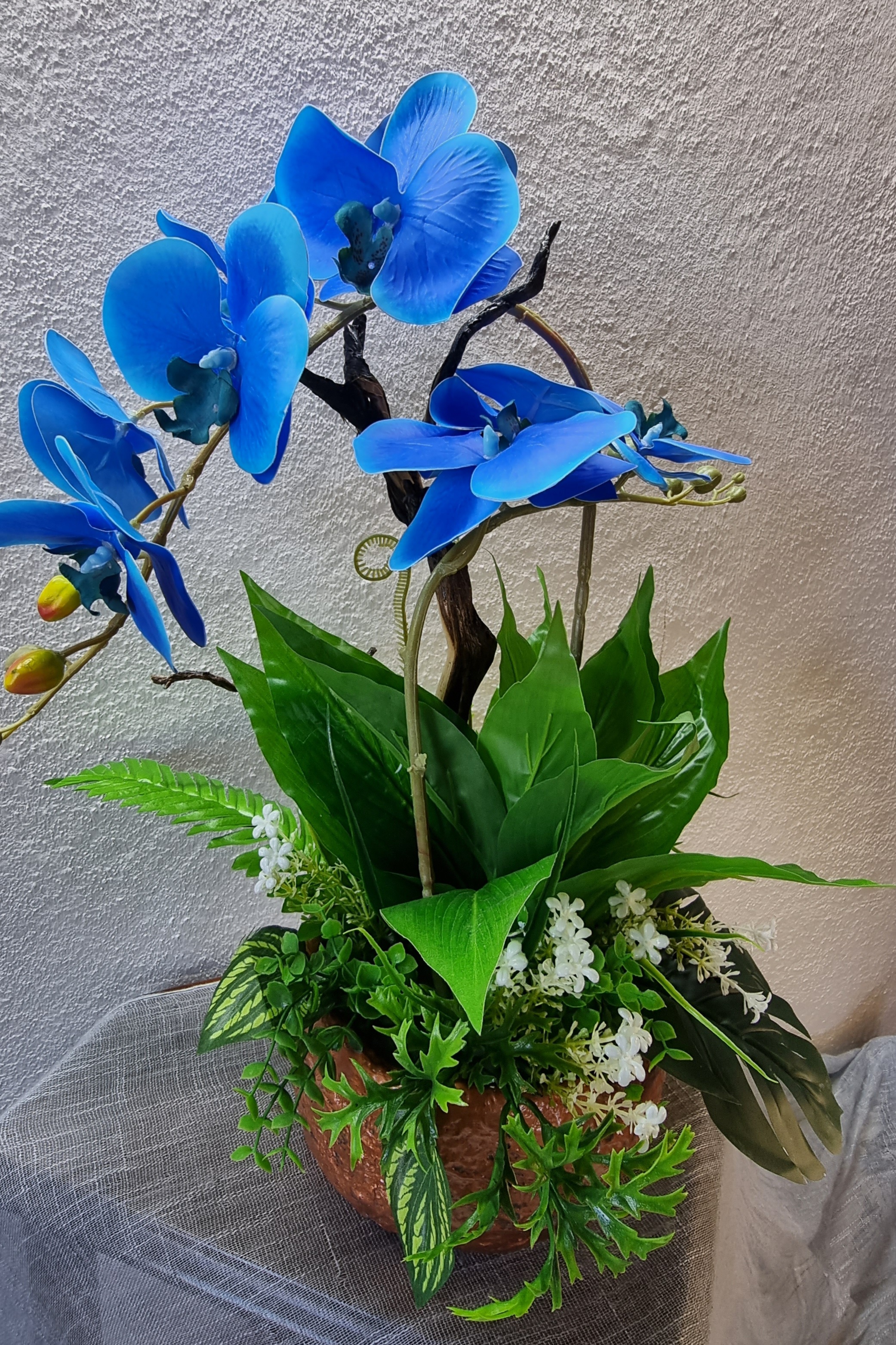 Big-size copper-colour planter with artificial blue orchids 