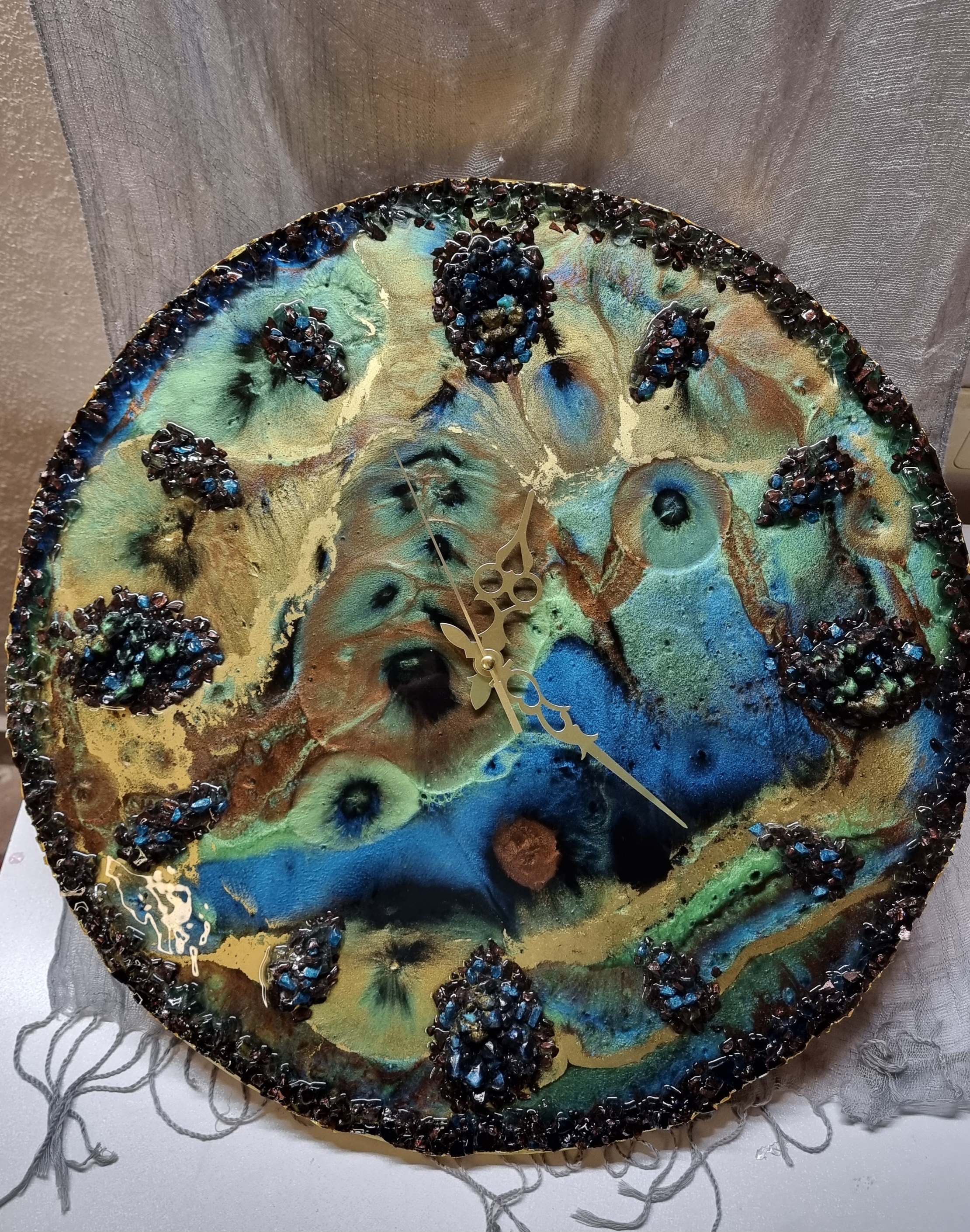 Designer-made one-of-a-kind epoxy-resin coated multi-colored wall clock. Diameter: 50 cm.