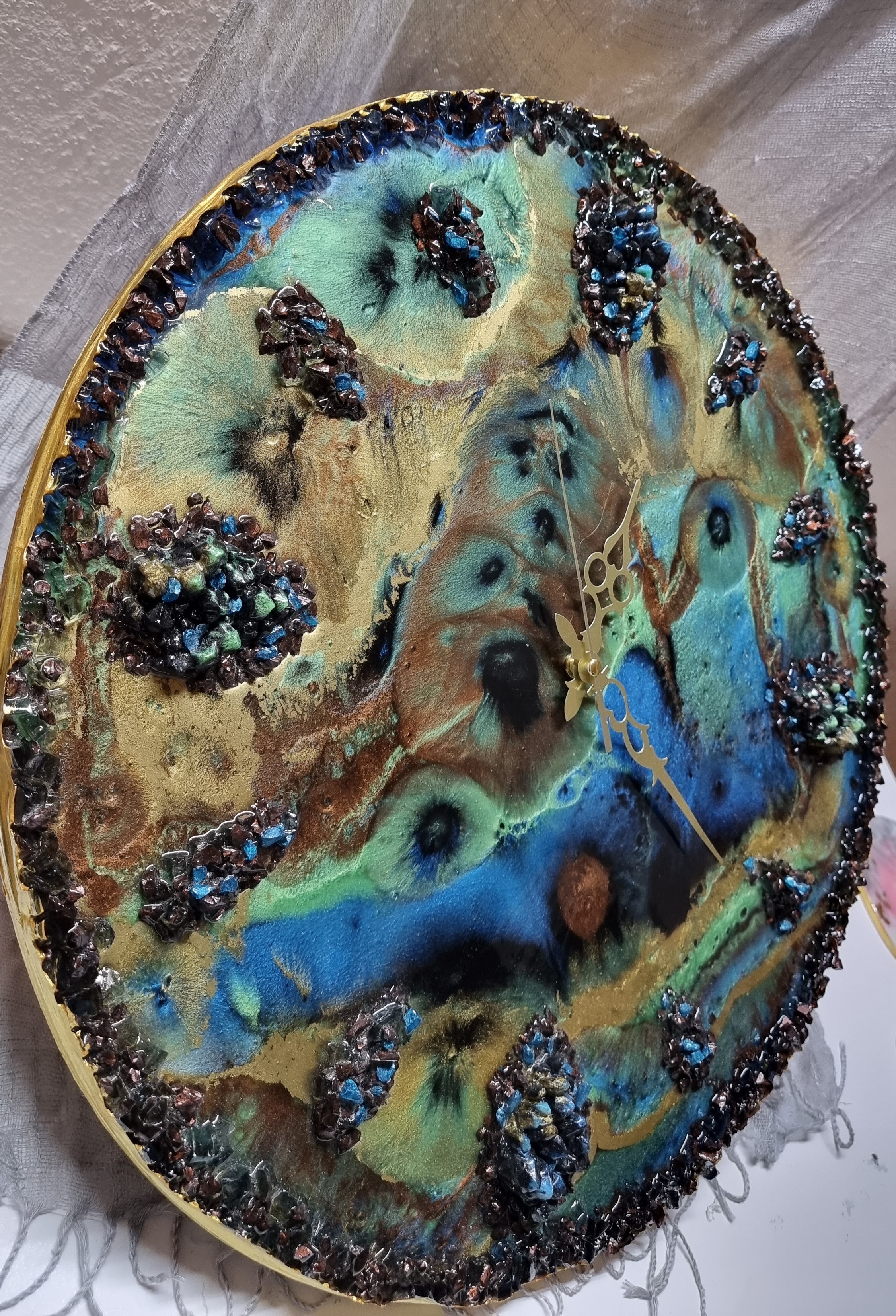 Designer-made one-of-a-kind epoxy-resin coated multi-colored wall clock. Diameter: 50 cm.