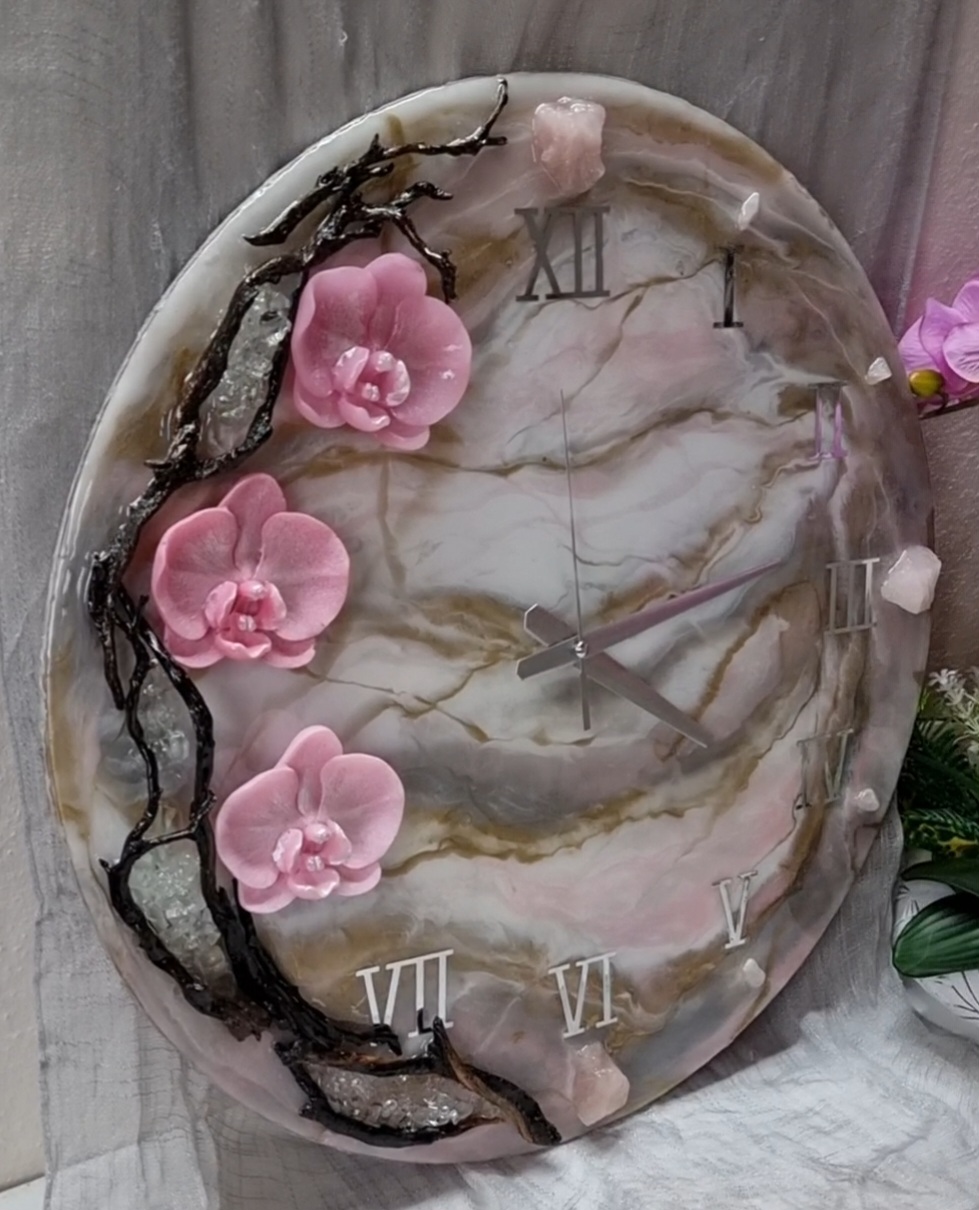 Pink epoxy-resin coated clock featuring orchids, driftwood and Roman numbers. Size (diameter) ranges from 14 to 23,8 inches. 