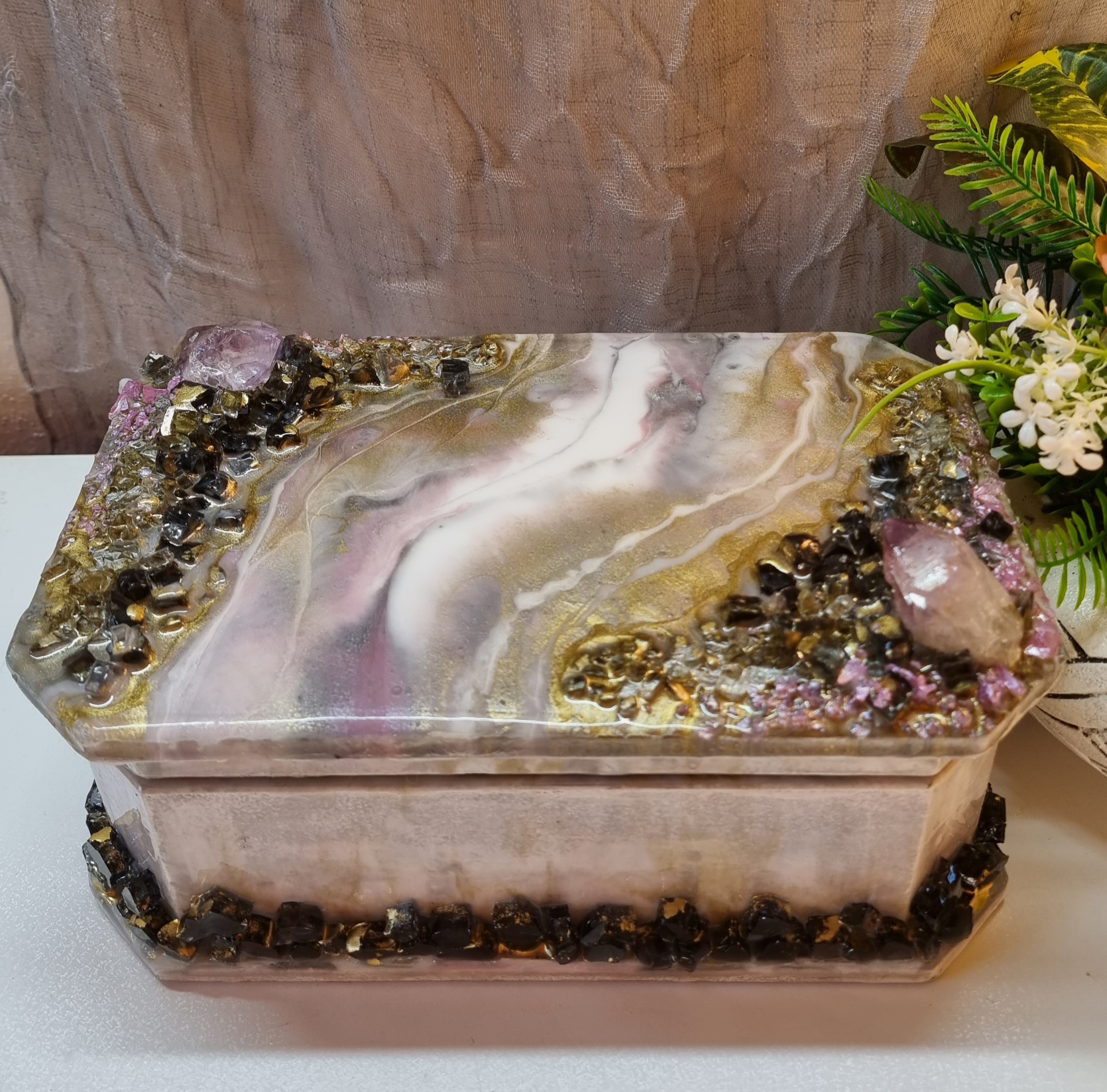 Rectangular pink-coloured epoxy-resin coated jewellery box adorned with natural amethysts