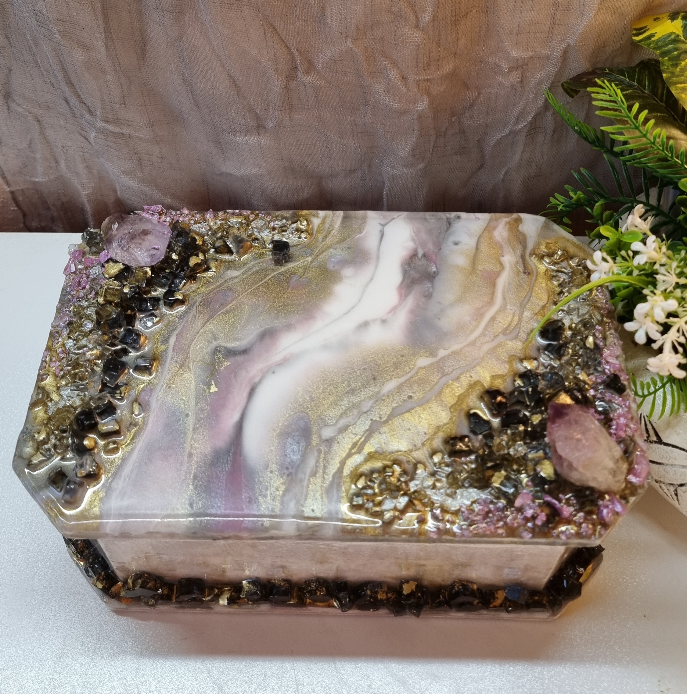 Rectangular pink-coloured epoxy-resin coated jewellery box adorned with natural amethysts