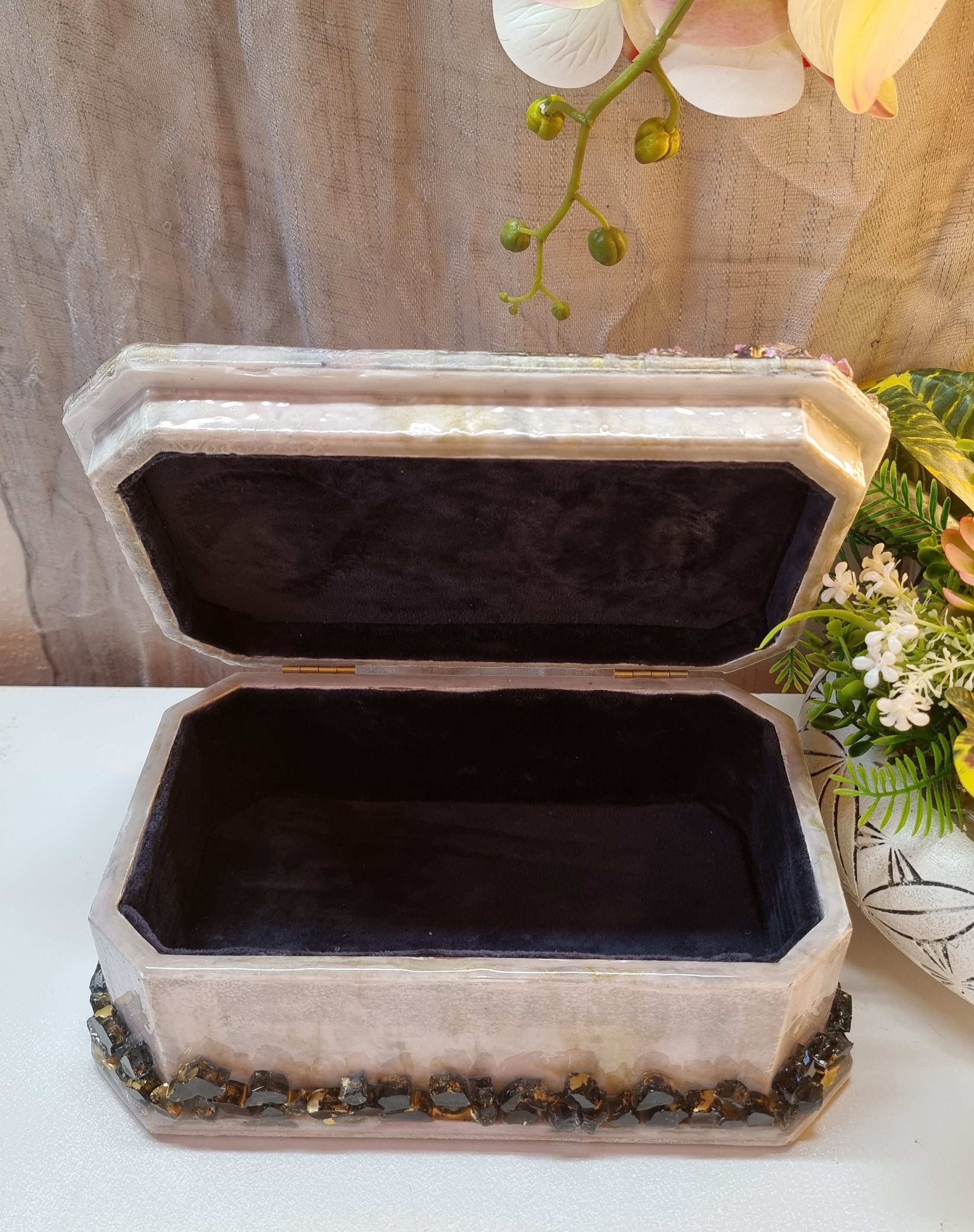 Rectangular pink-coloured epoxy-resin coated jewellery box adorned with natural amethysts